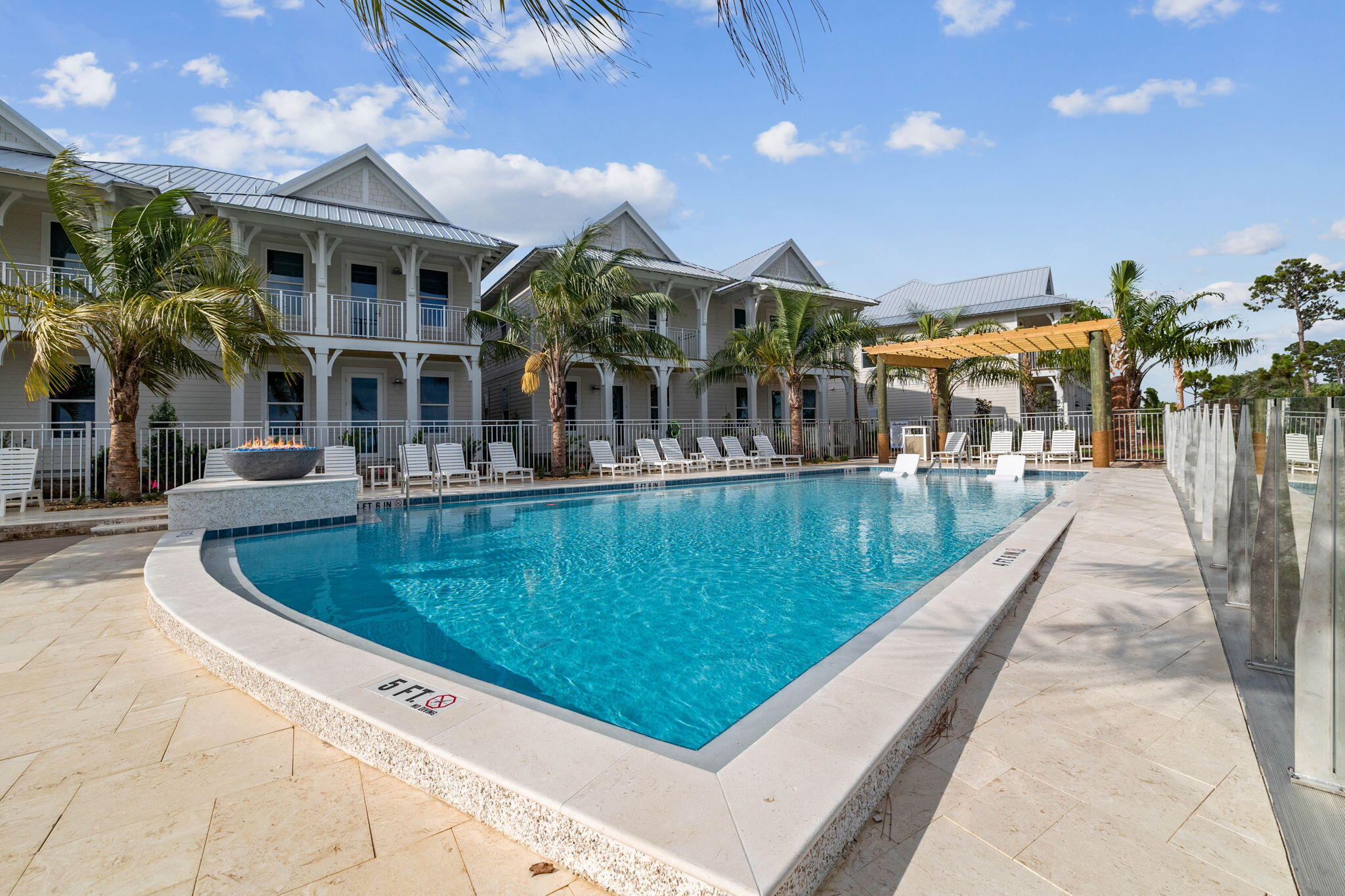 264 Dockside Drive Port St. Joe, FL 32456 - Photo 54 of 65 a view of a swimming pool with a patio