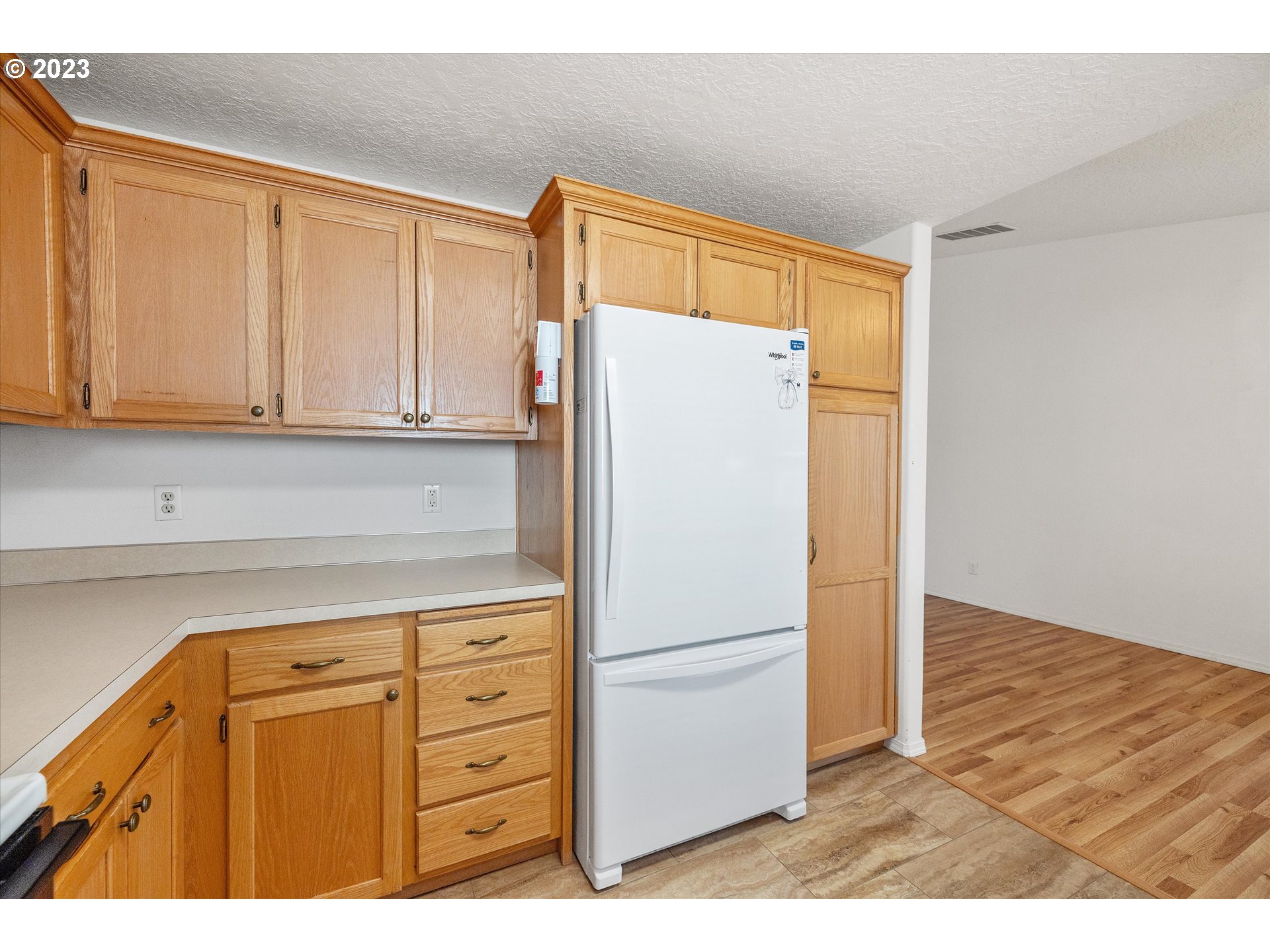 37308 Rachael Drive Sandy, OR 97055 - Photo 12 of 29 a view of a kitchen with refrigerator and cabinet