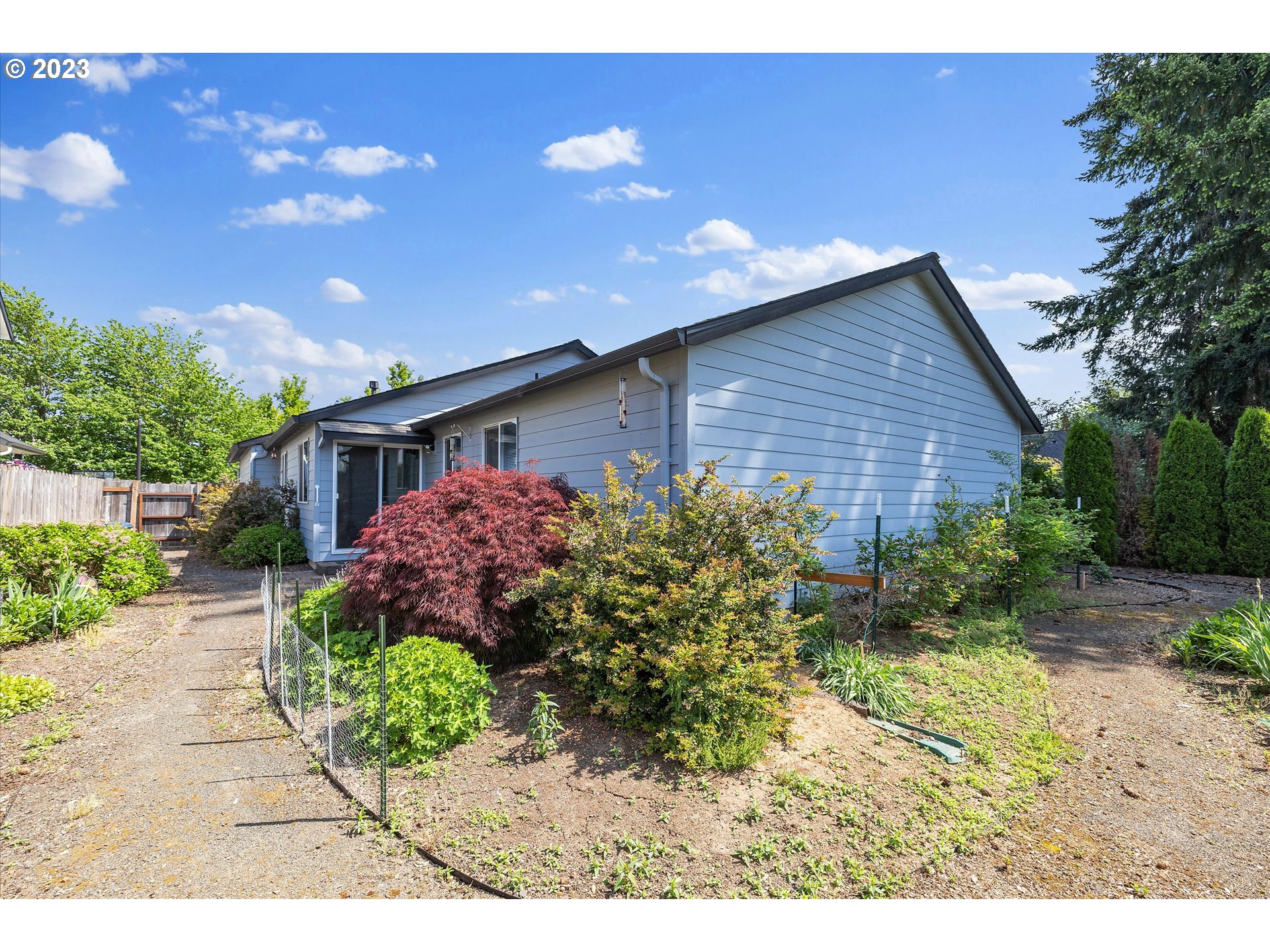 37308 Rachael Drive Sandy, OR 97055 - Photo 25 of 29 a front view of a house with a yard