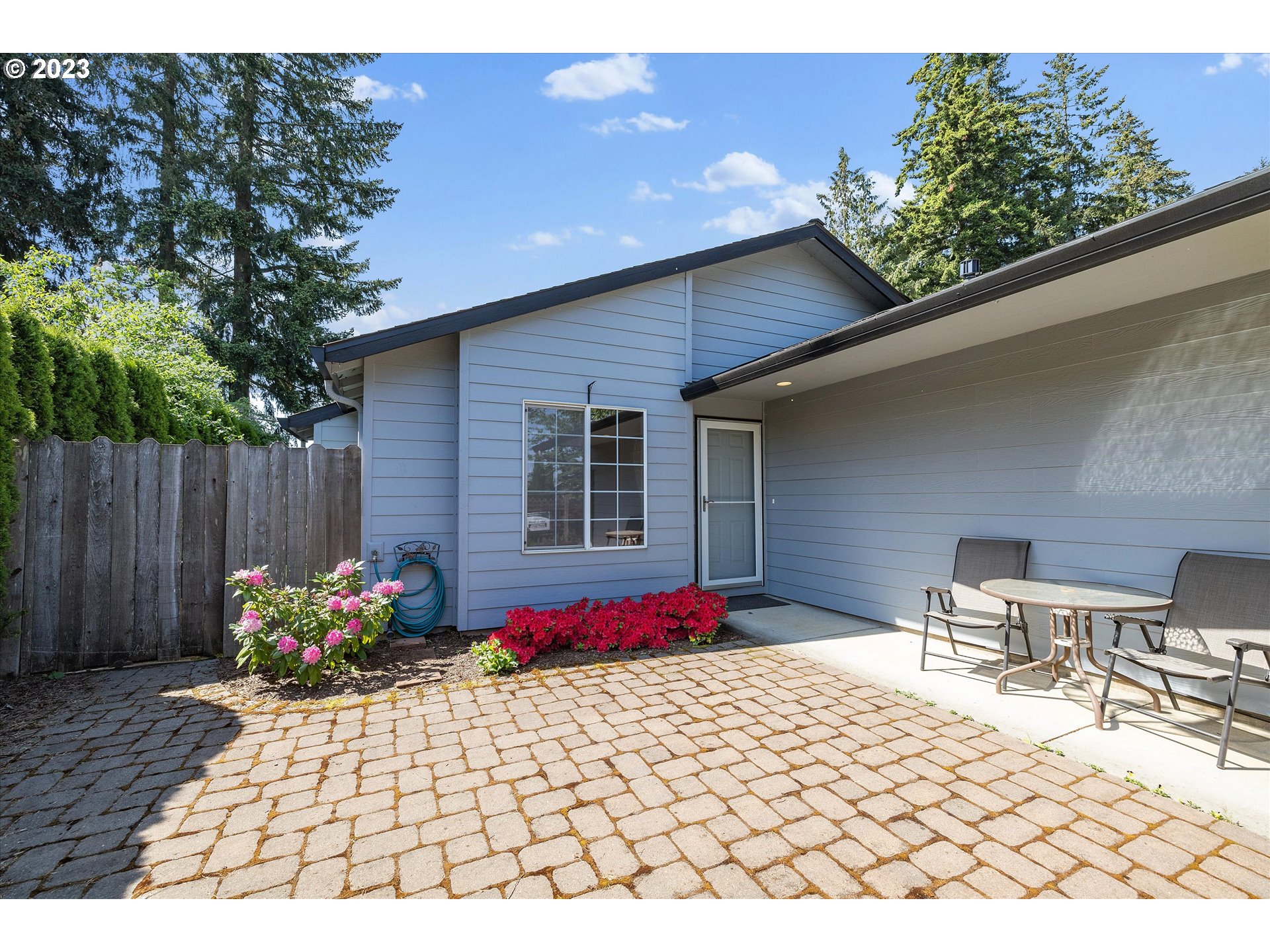 37308 Rachael Drive Sandy, OR 97055 - Photo 3 of 29 a patio with table and chairs and potted plants