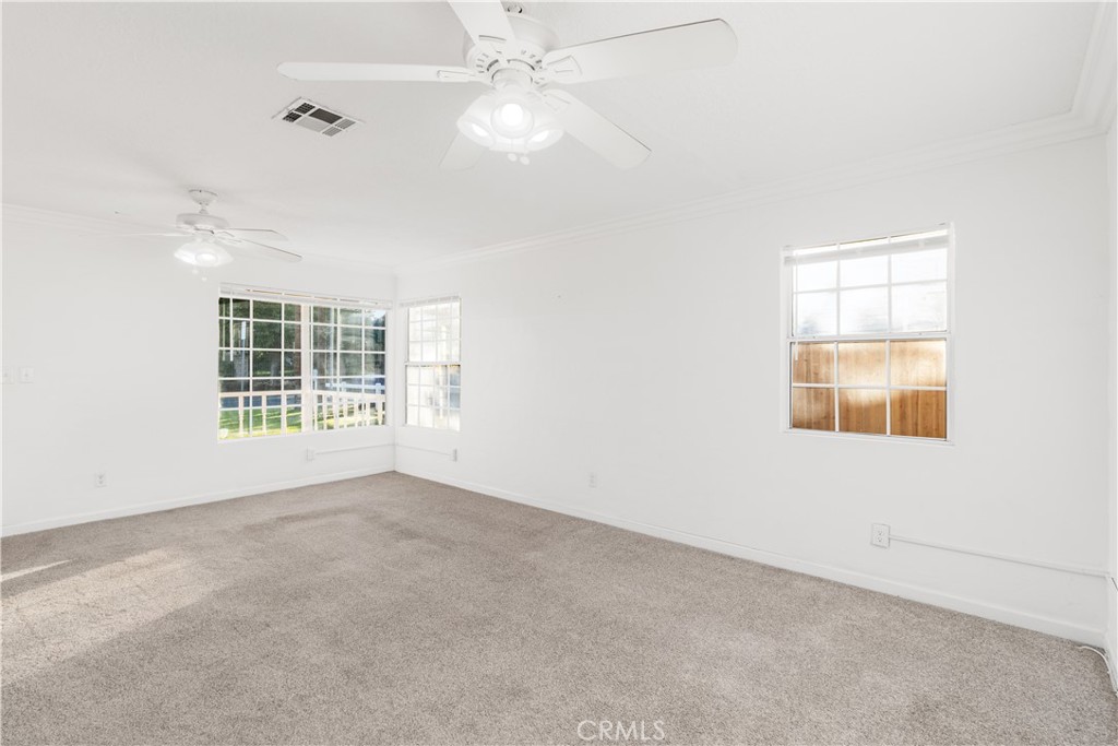 2572 Harrison Street Riverside, CA 92503 - Photo 18 of 73 an empty room with windows and fan
