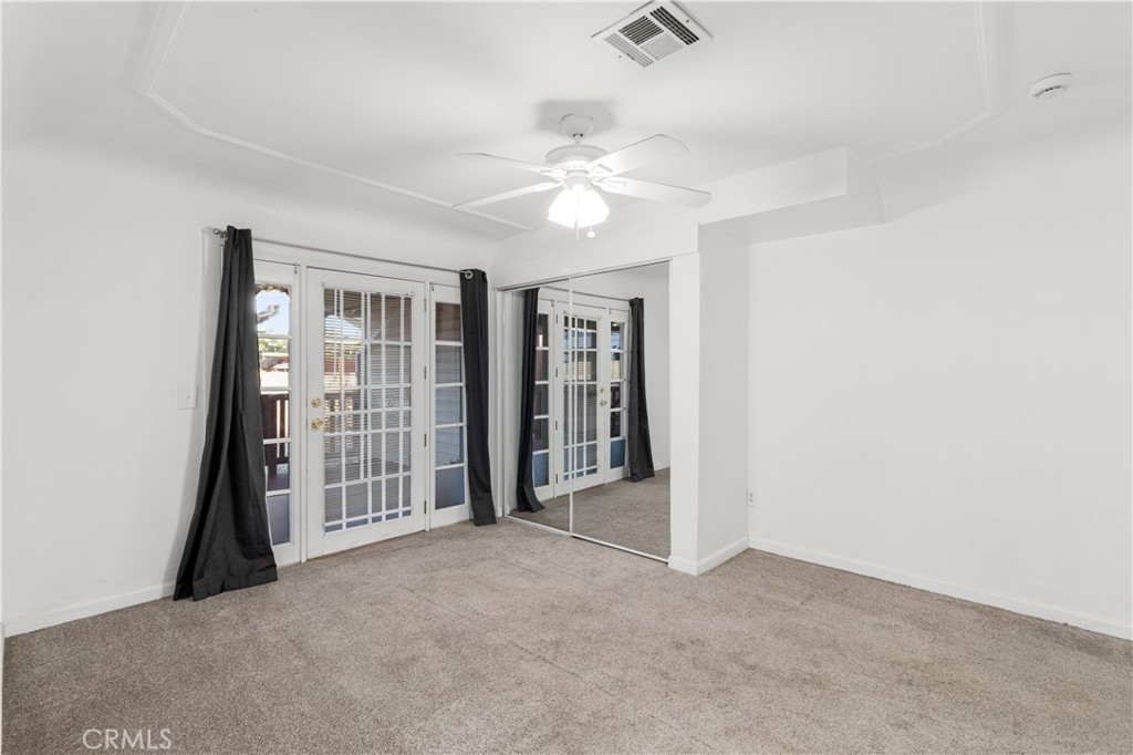 2572 Harrison Street Riverside, CA 92503 - Photo 28 of 73 an empty room with fan and windows