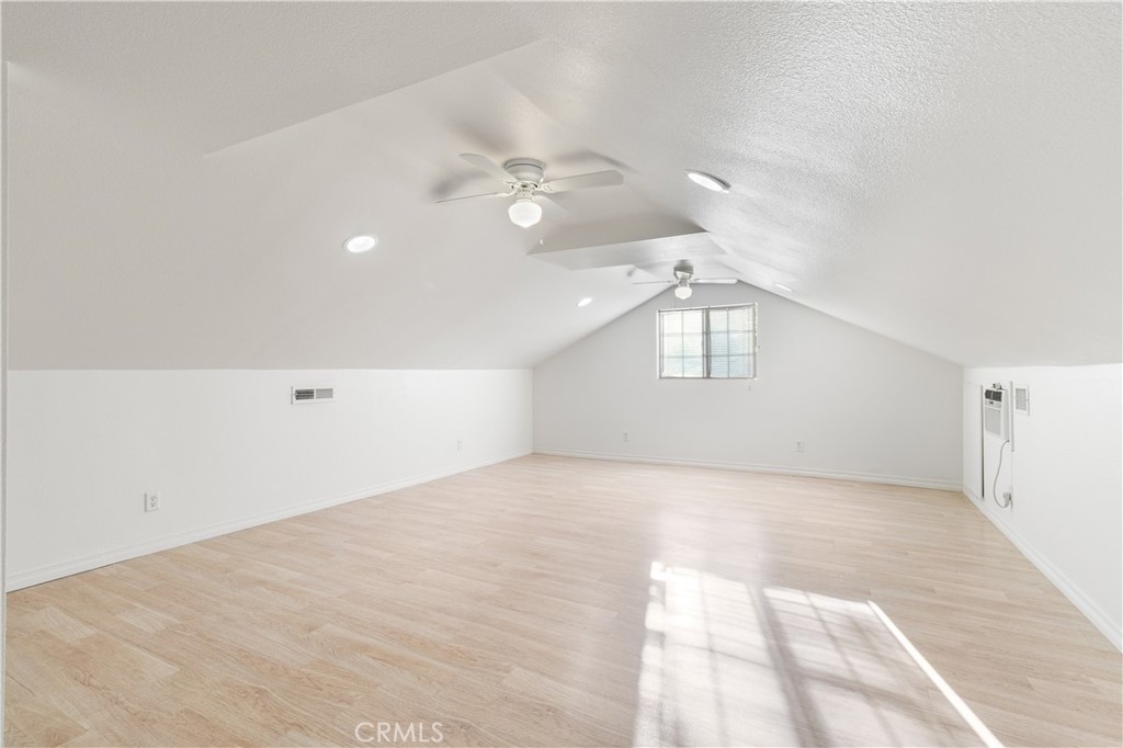 2572 Harrison Street Riverside, CA 92503 - Photo 64 of 73 en empty room with windows and ceiling fan