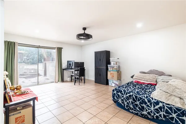 a bedroom with a bed and a table