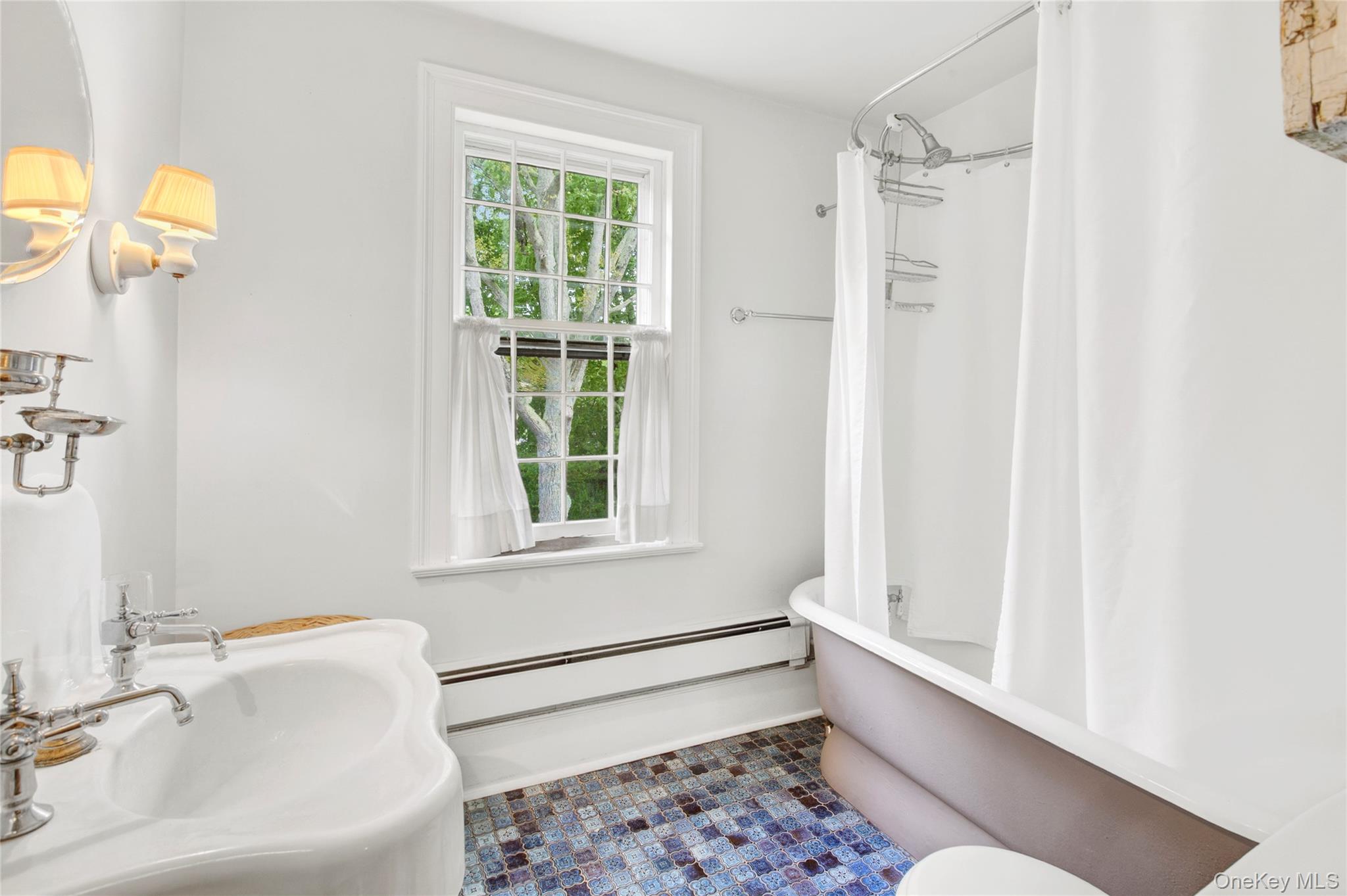 750 Reeve Avenue Mattituck, NY 11952 - Photo 39 of 41 a bathroom with a bathtub and a sink