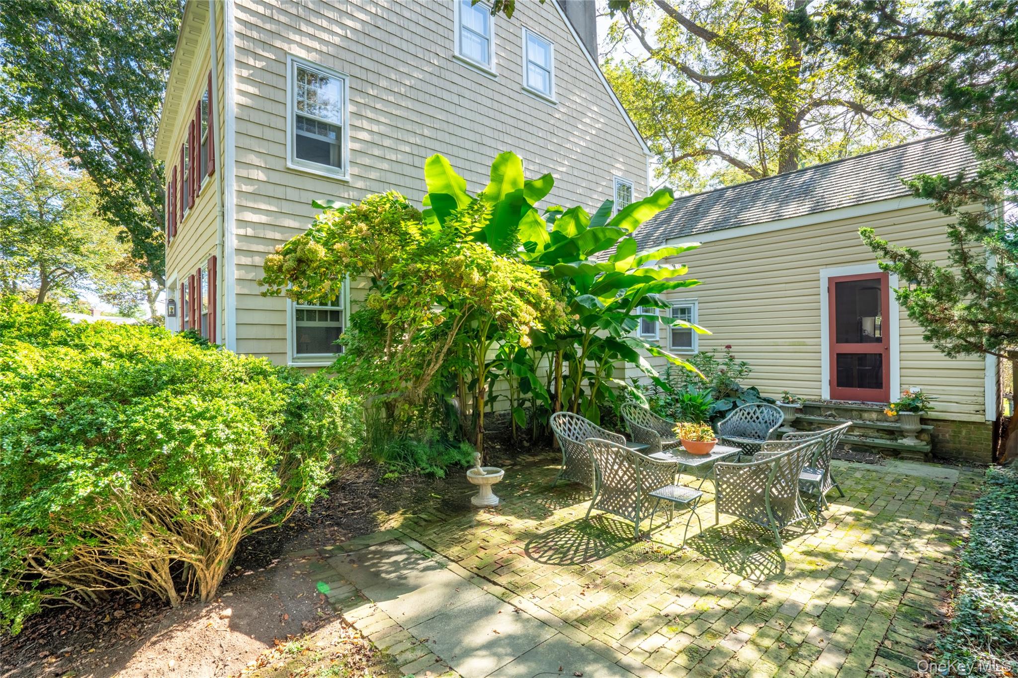 750 Reeve Avenue Mattituck, NY 11952 - Photo 7 of 41 a plant that is in front of a house