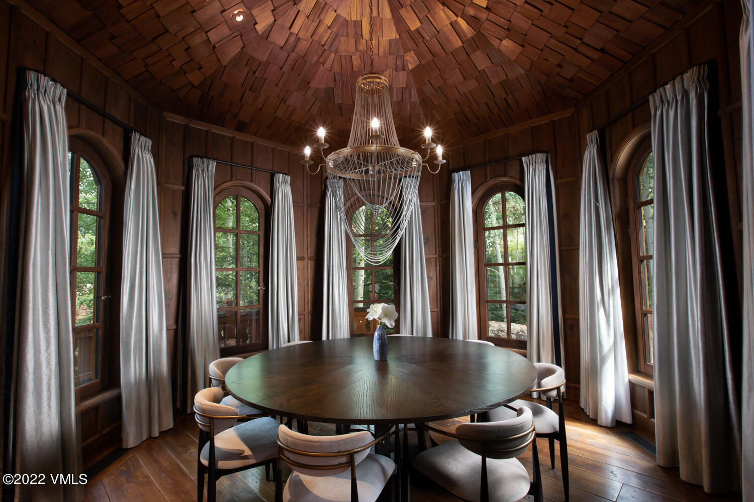 97 Rockledge Road Vail, CO 81657 - Photo 12 of 35 a view of a dining room with furniture window and wooden floor