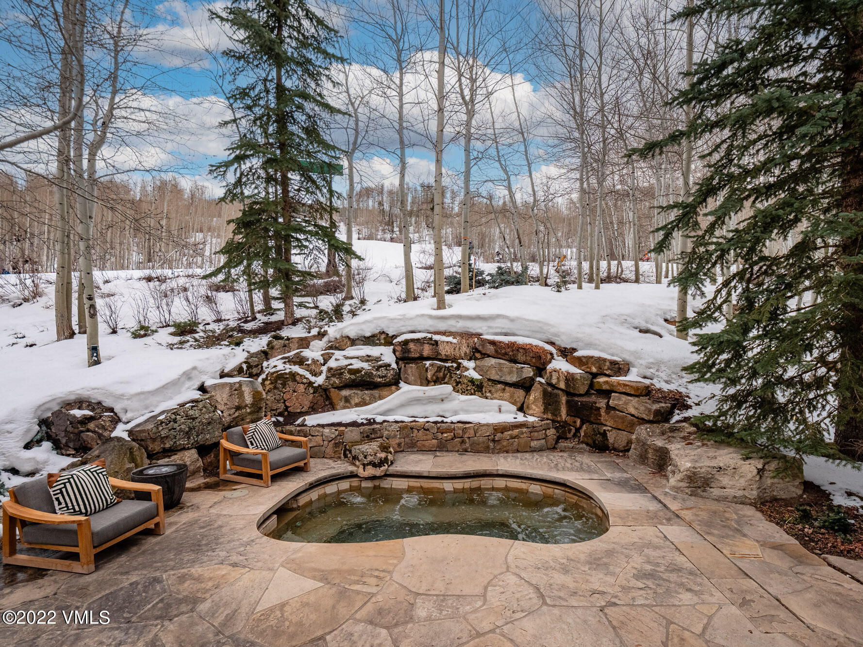 97 Rockledge Road Vail, CO 81657 - Photo 20 of 35 a view of outdoor space with swimming pool and lounge chair
