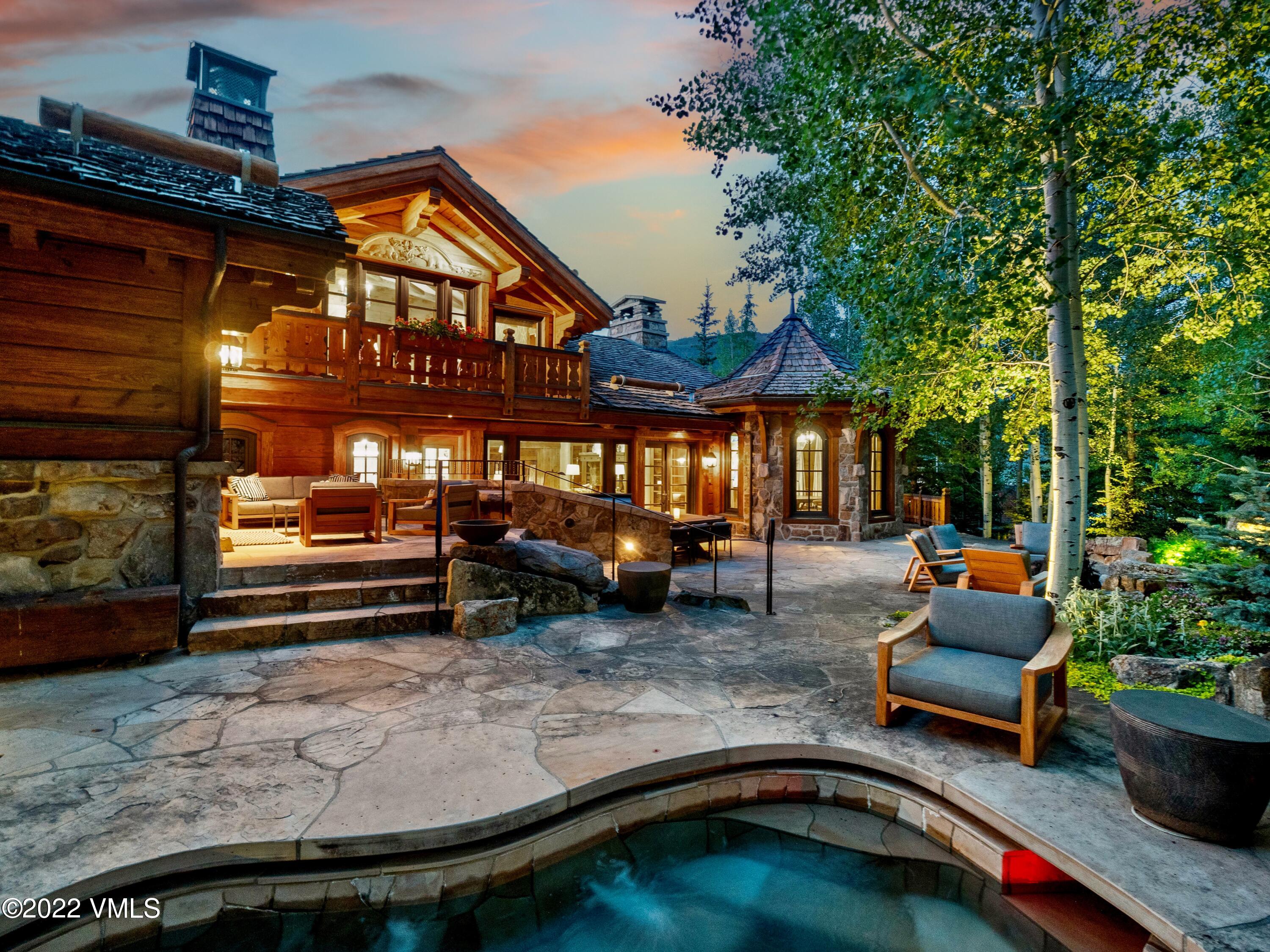 97 Rockledge Road Vail, CO 81657 - Photo 2 of 35 a view of a patio with table and chairs and potted plants