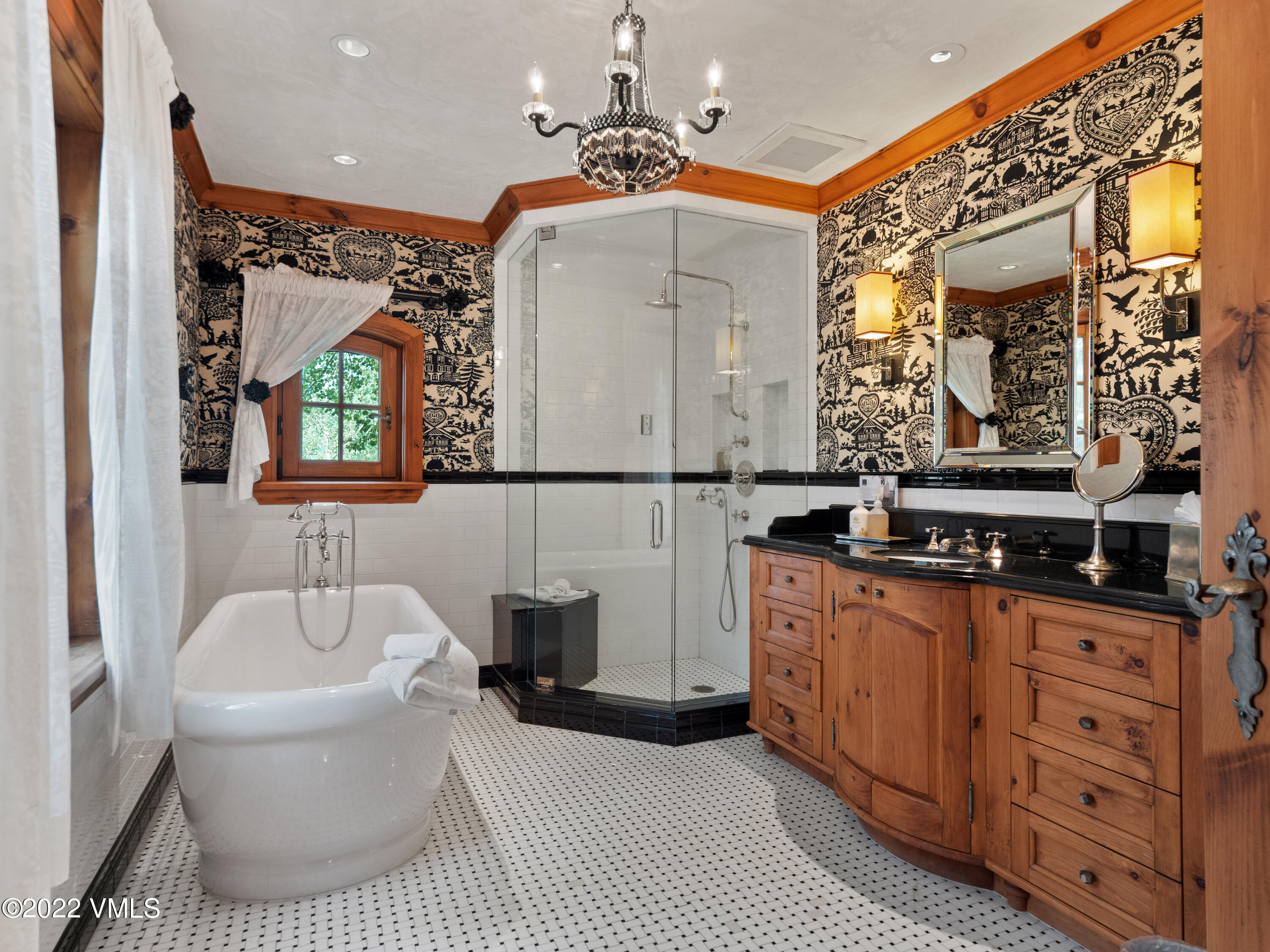 97 Rockledge Road Vail, CO 81657 - Photo 23 of 35 a bathroom with a sink a mirror and a bathtub