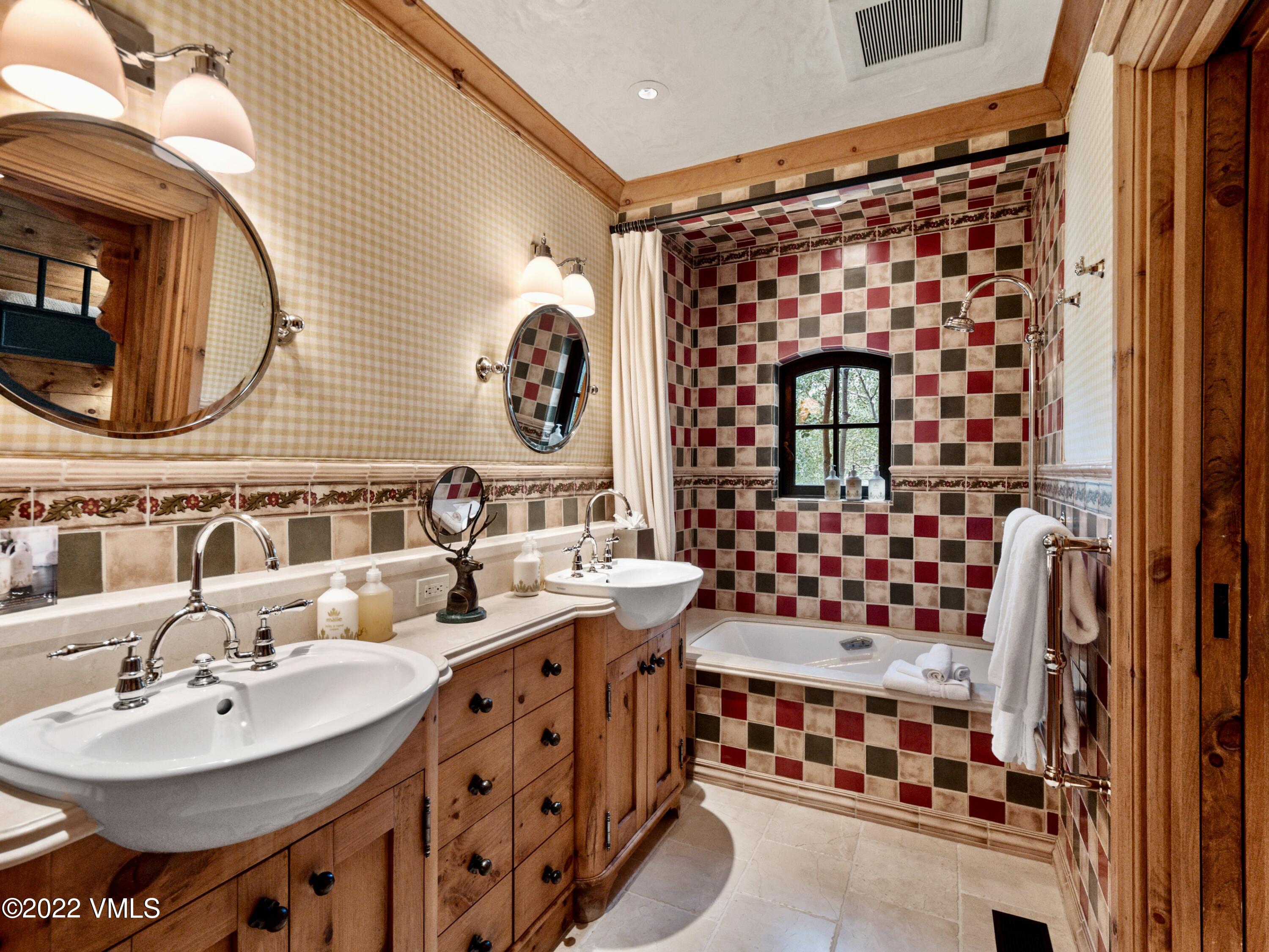 97 Rockledge Road Vail, CO 81657 - Photo 30 of 35 a bathroom with a sink mirror and vanity