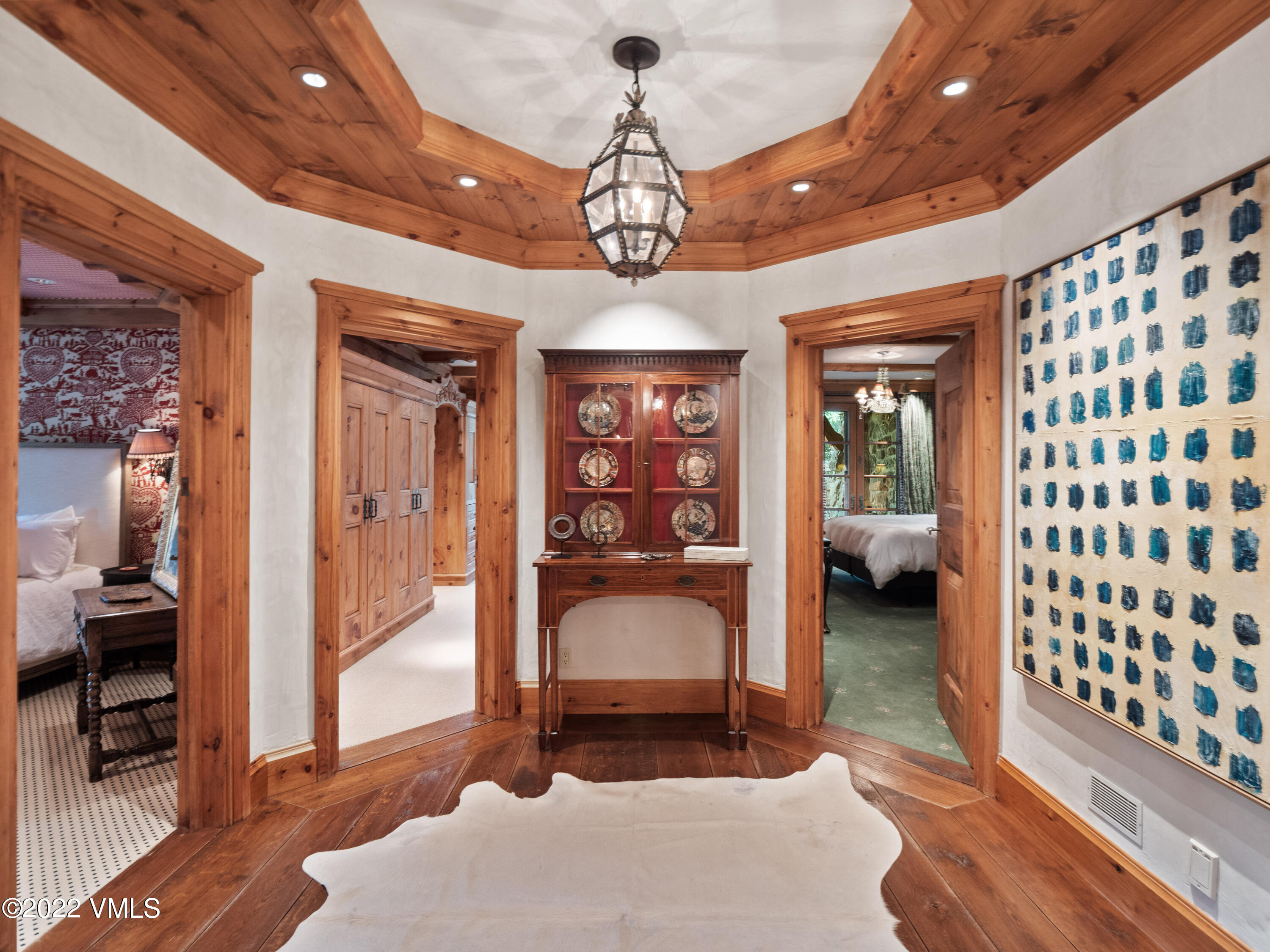 97 Rockledge Road Vail, CO 81657 - Photo 31 of 35 a very nice looking room with a large window and chandelier