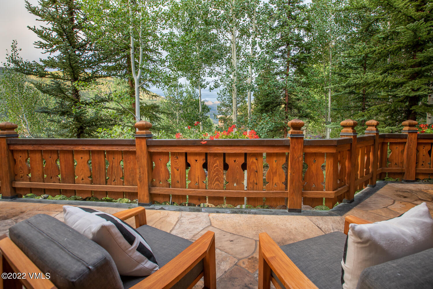 97 Rockledge Road Vail, CO 81657 - Photo 32 of 35 a view of a chairs and table in the backyard