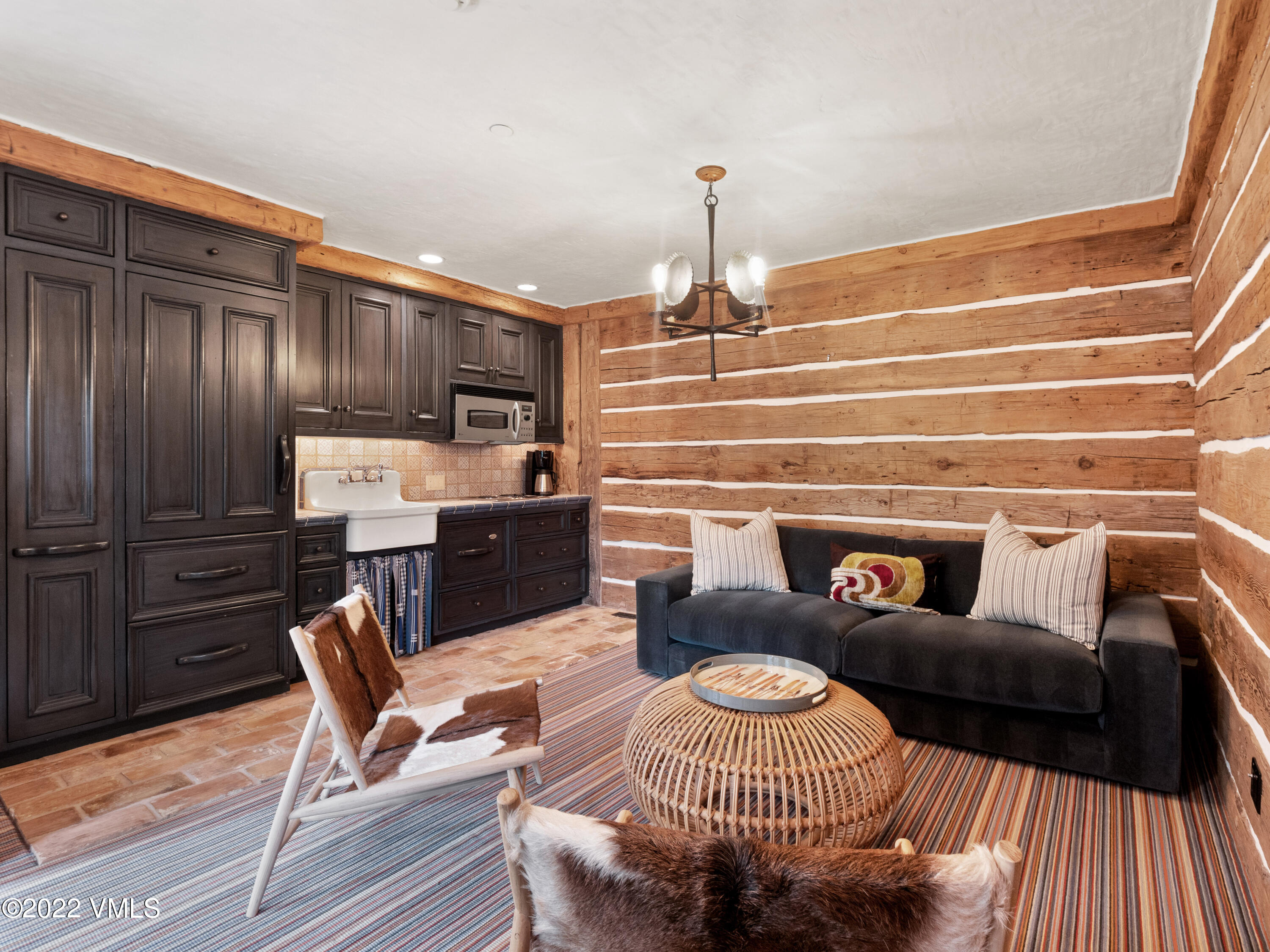 97 Rockledge Road Vail, CO 81657 - Photo 33 of 35 a living room with furniture and a fireplace