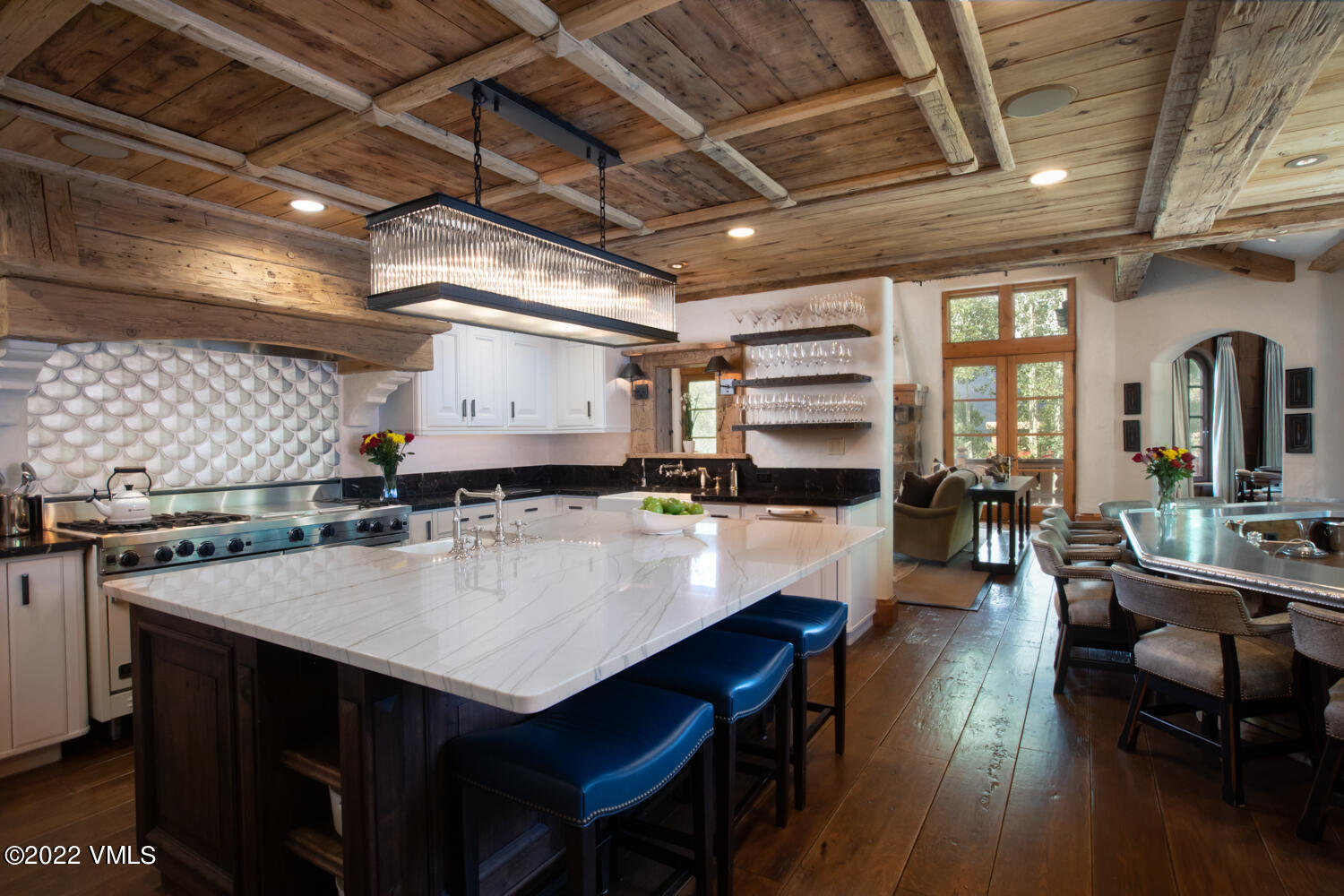 97 Rockledge Road Vail, CO 81657 - Photo 6 of 35 a large kitchen with a table and chairs in it
