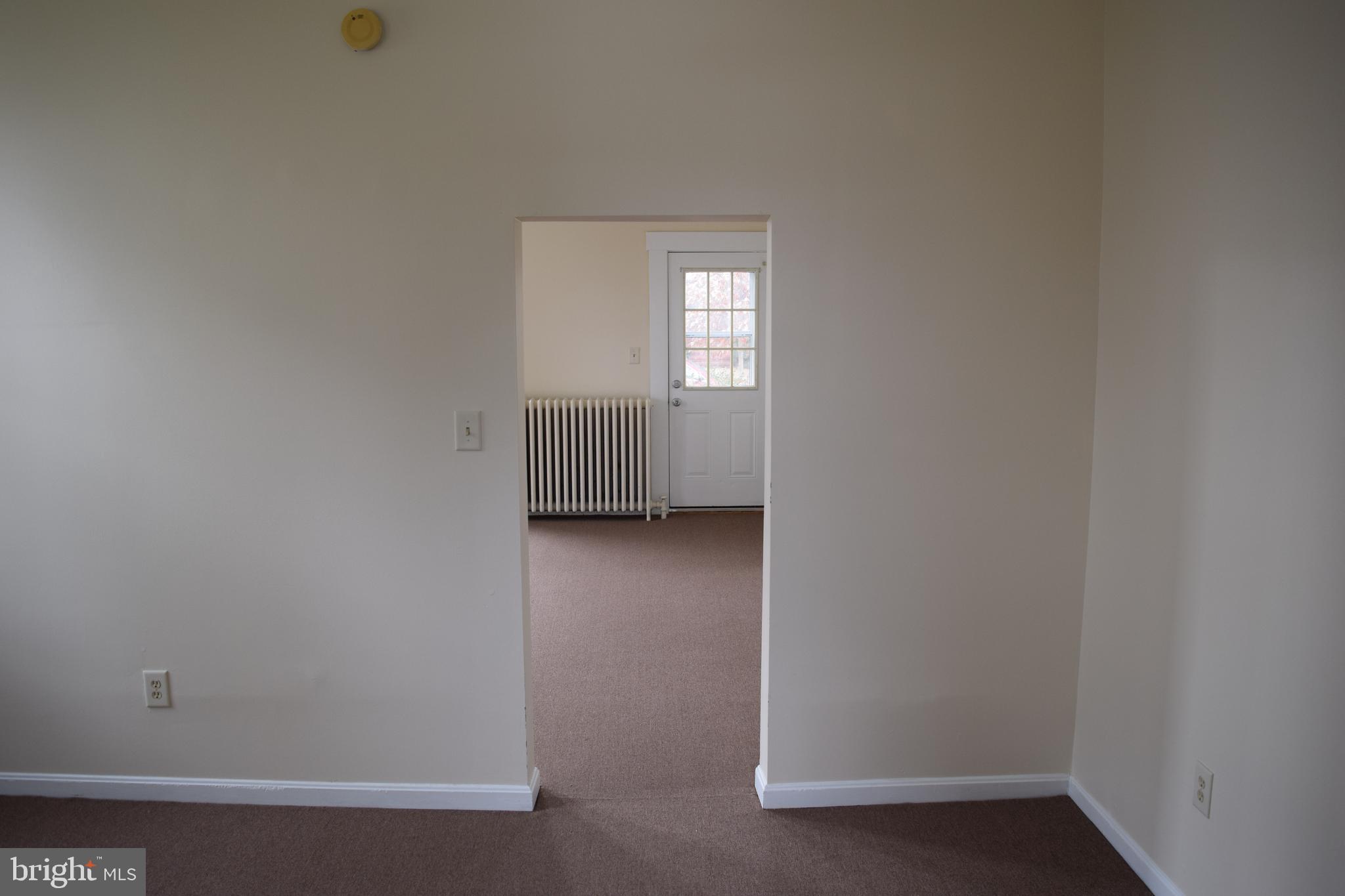 3810 Chesley Avenue Baltimore, MD 21206 - Photo 14 of 14 a view of a small space with wooden floor and a window