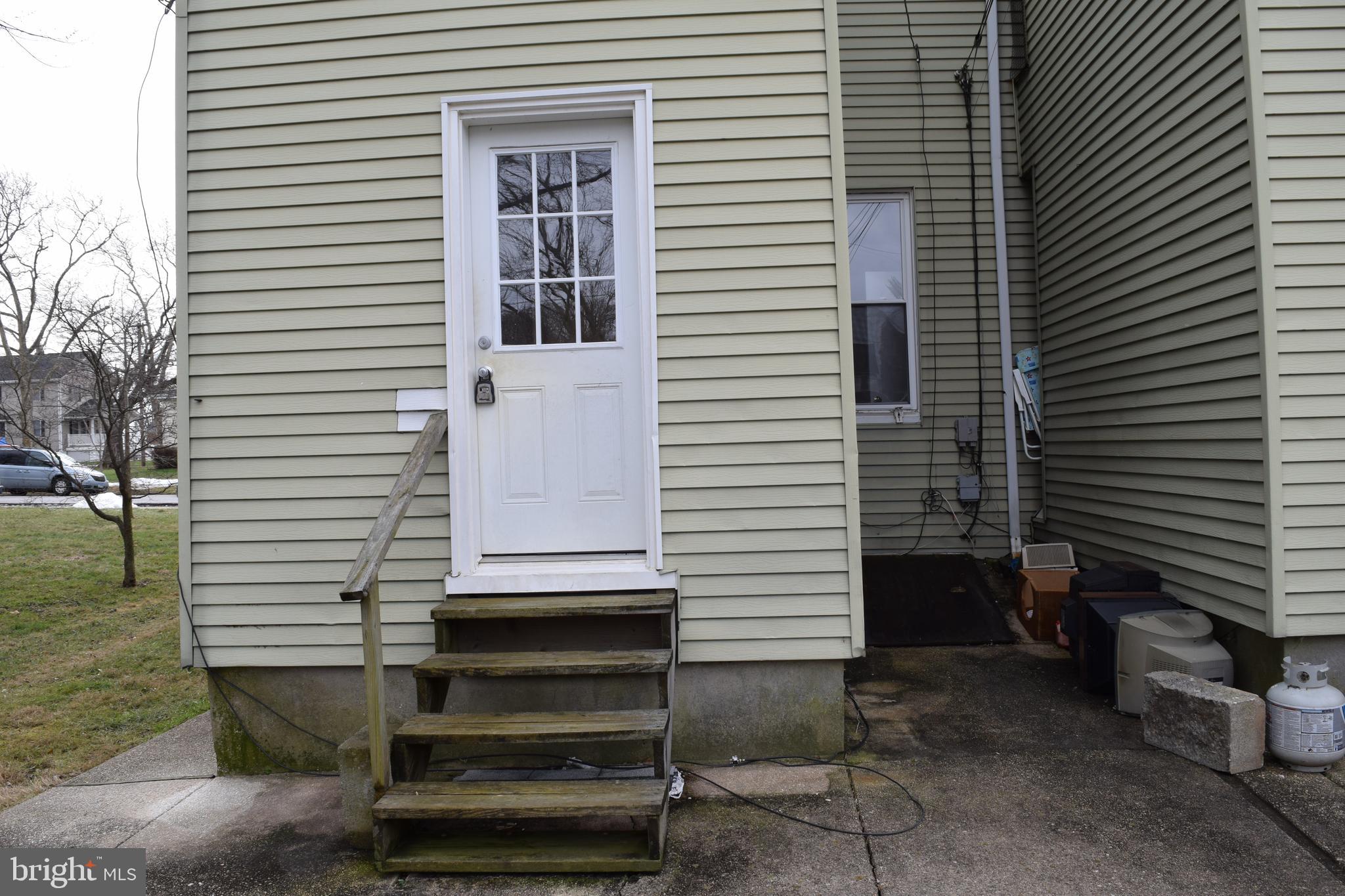 3810 Chesley Avenue Baltimore, MD 21206 - Photo 2 of 14 a view of a house with a door and a yard