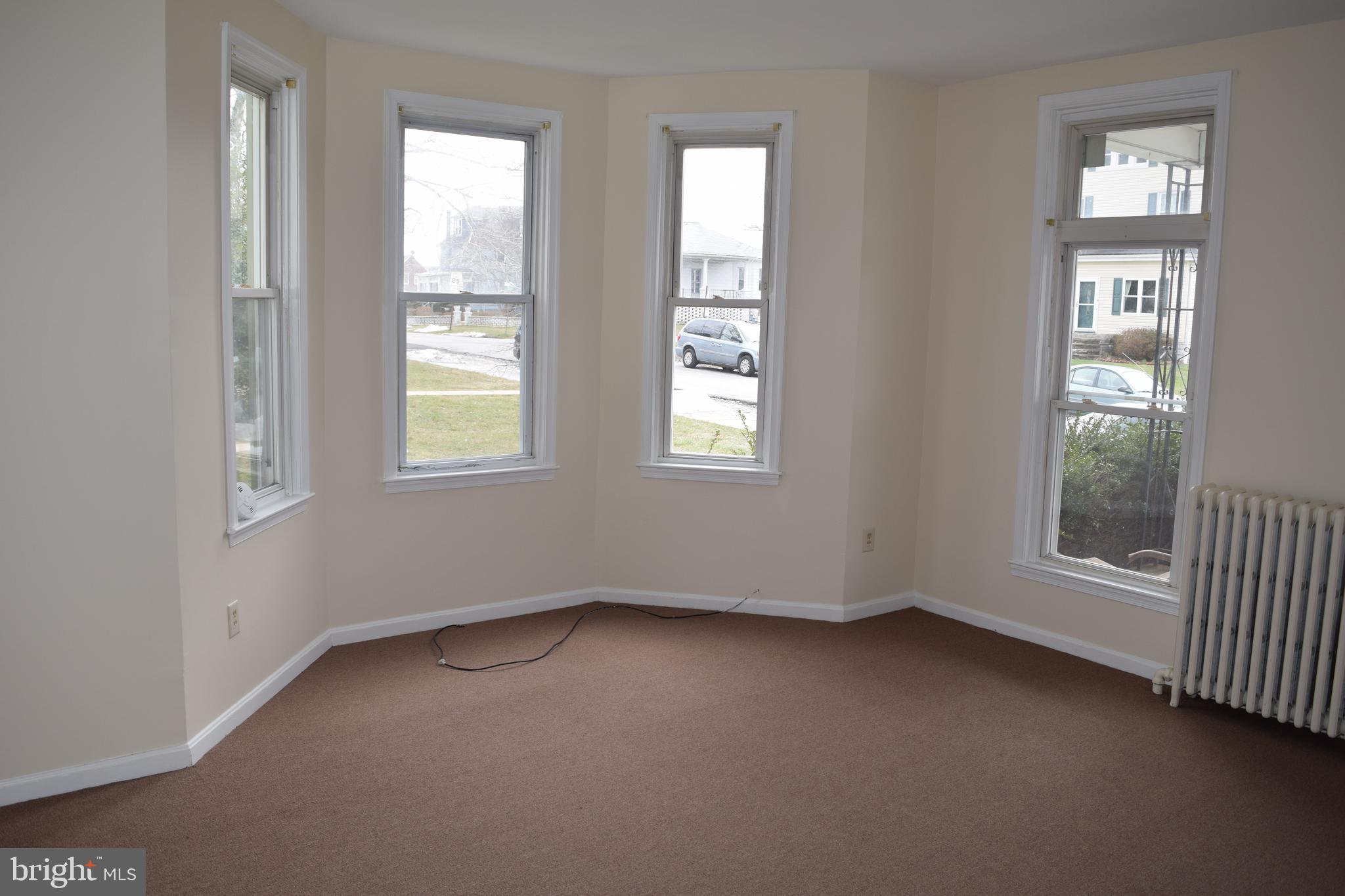 3810 Chesley Avenue Baltimore, MD 21206 - Photo 5 of 14 an empty room with a window