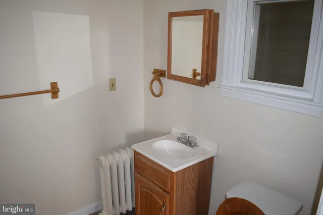 a bathroom with a sink and mirror
