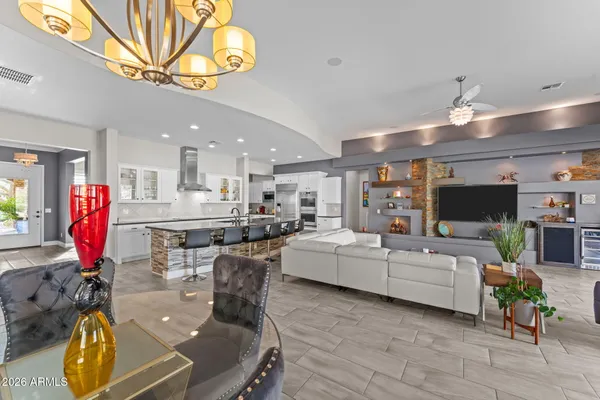 a bedroom with a bed and a large mirror