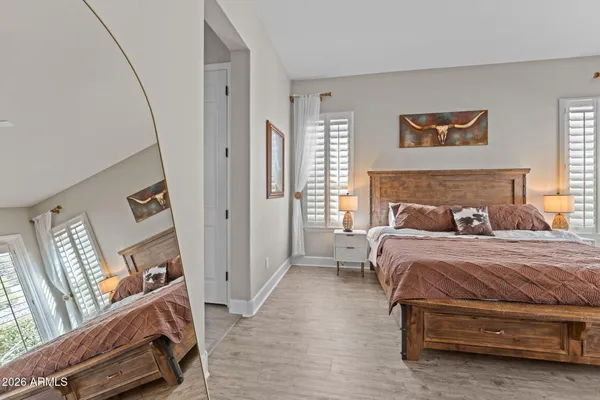 a living room with fireplace furniture and a large window