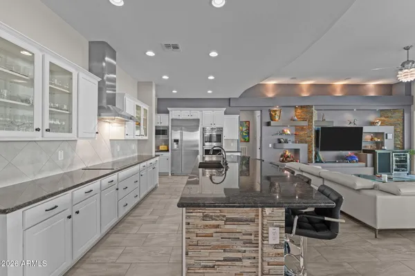 a view of a kitchen with sink cabinets and appliances