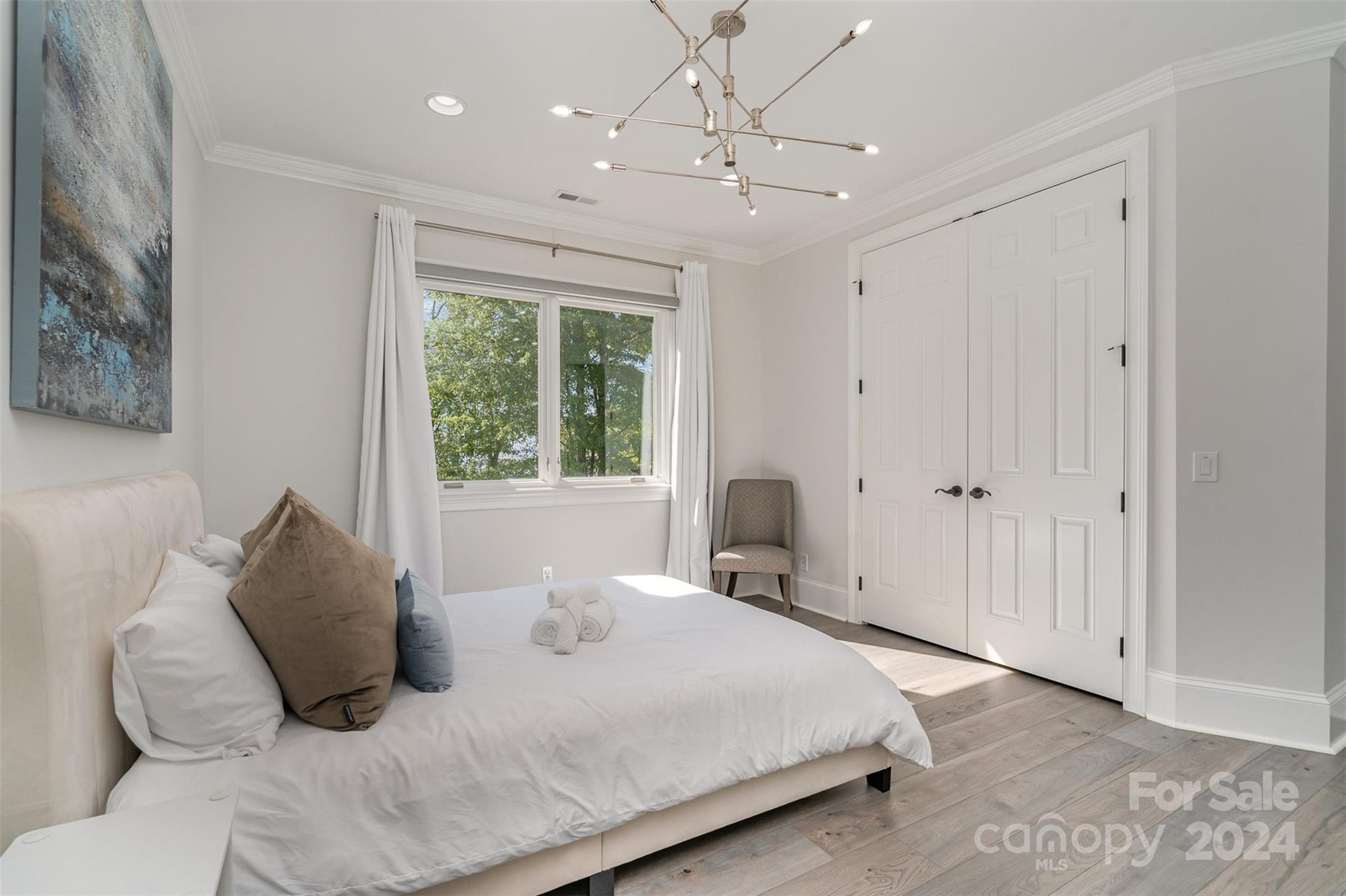 199 Washam Road Mooresville, NC 28117 - Photo 27 of 44 a bedroom with a large bed and a window