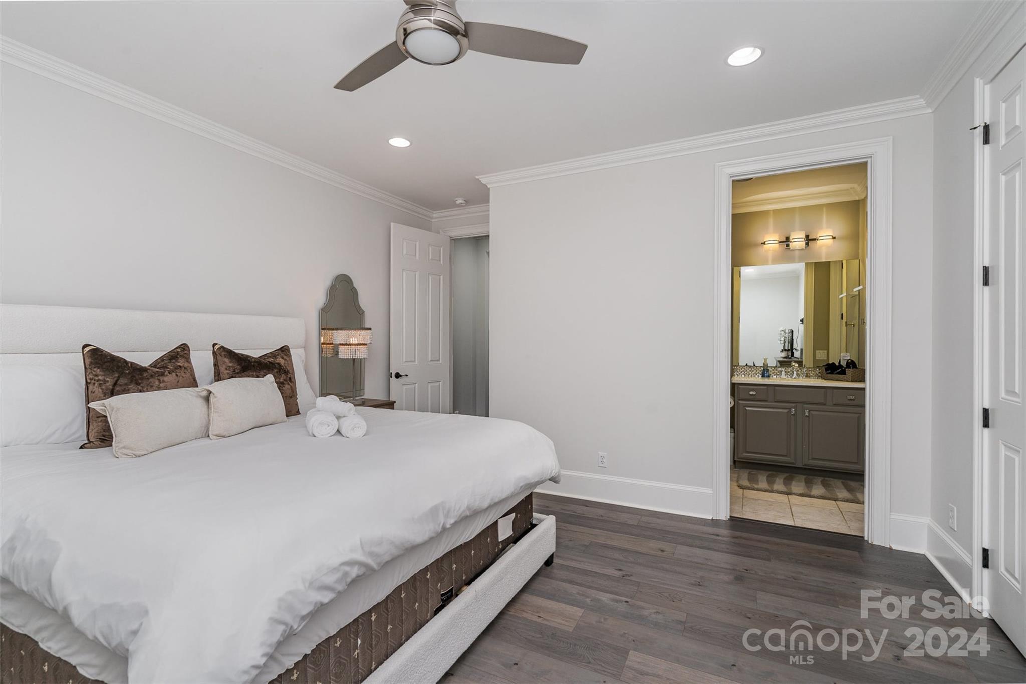 199 Washam Road Mooresville, NC 28117 - Photo 33 of 44 a bedroom with a bed and a chandelier