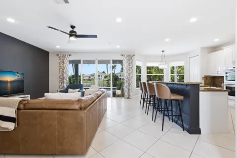 a living room with furniture a window and a dining table