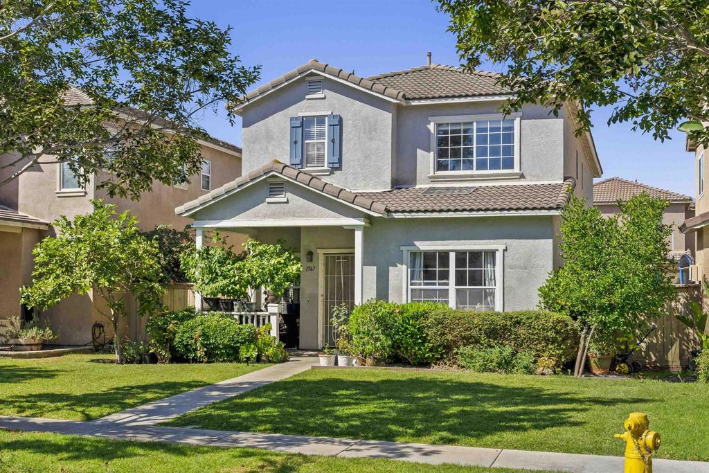 1567 Gold Run Road Chula Vista, CA 91913 - Photo 1 of 1 a front view of a house with a yard