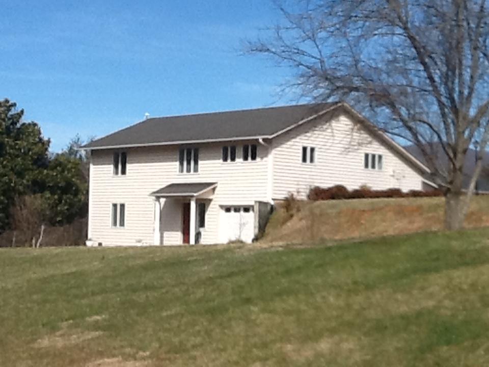 3315 Retreat Road Boones Mill, VA 24065 - Photo 2 of 57 a front view of a house with a yard