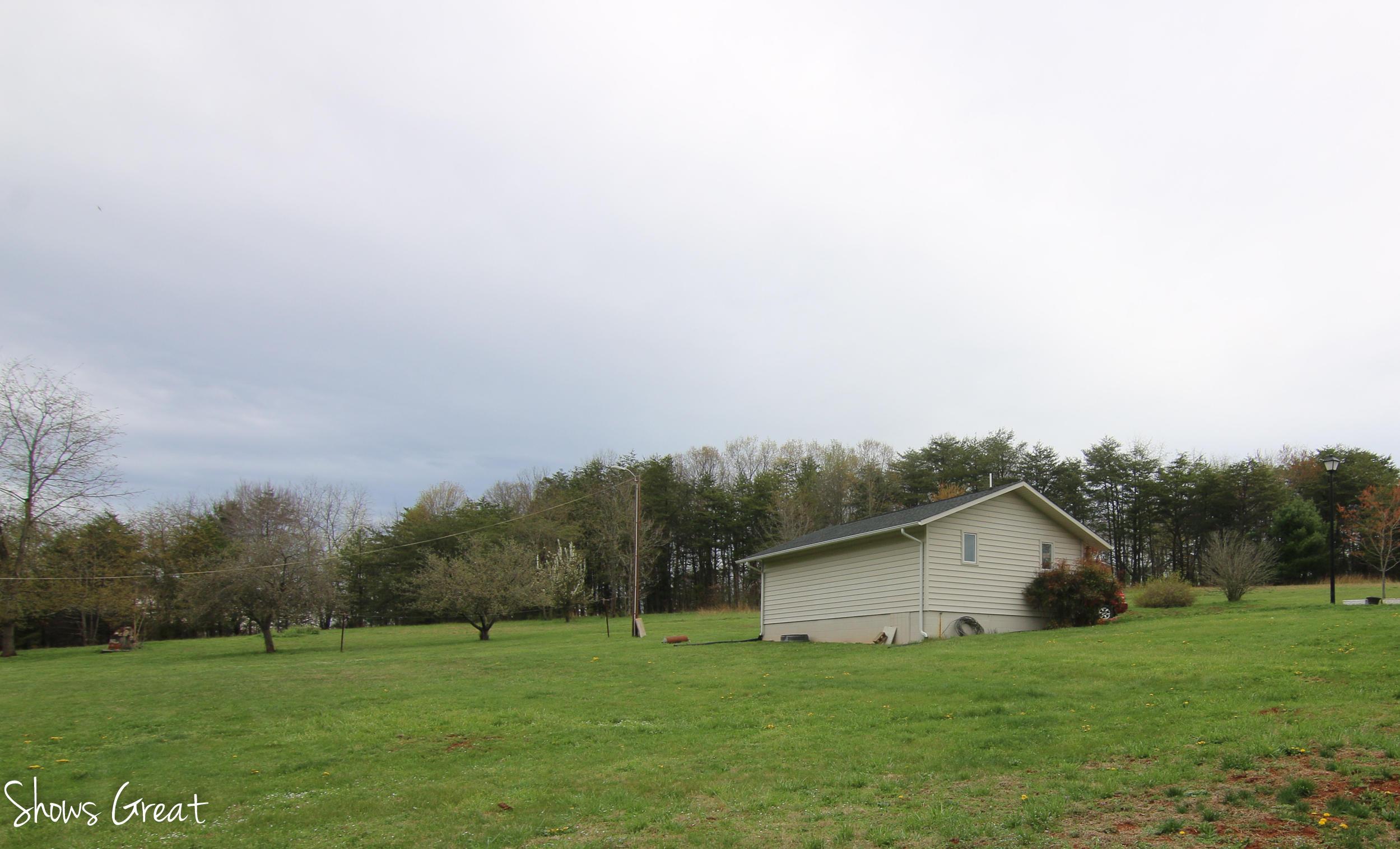 3315 Retreat Road Boones Mill, VA 24065 - Photo 20 of 57 a view of a backyard with large trees