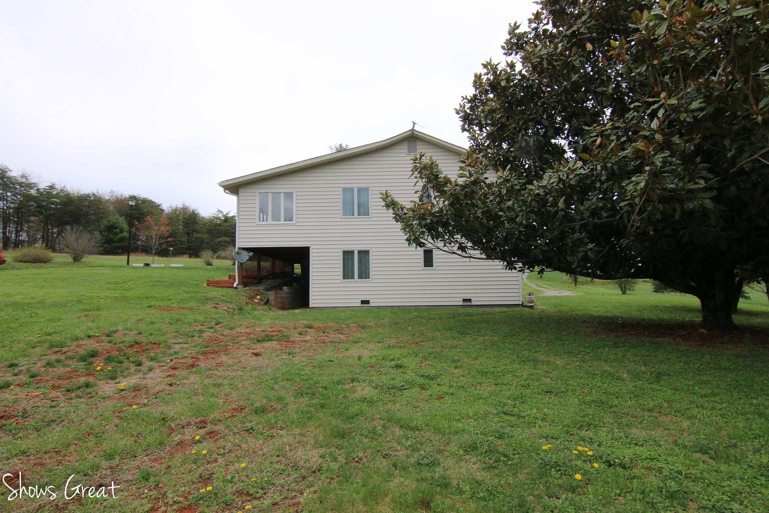 3315 Retreat Road Boones Mill, VA 24065 - Photo 21 of 57 a view of a backyard with a garden