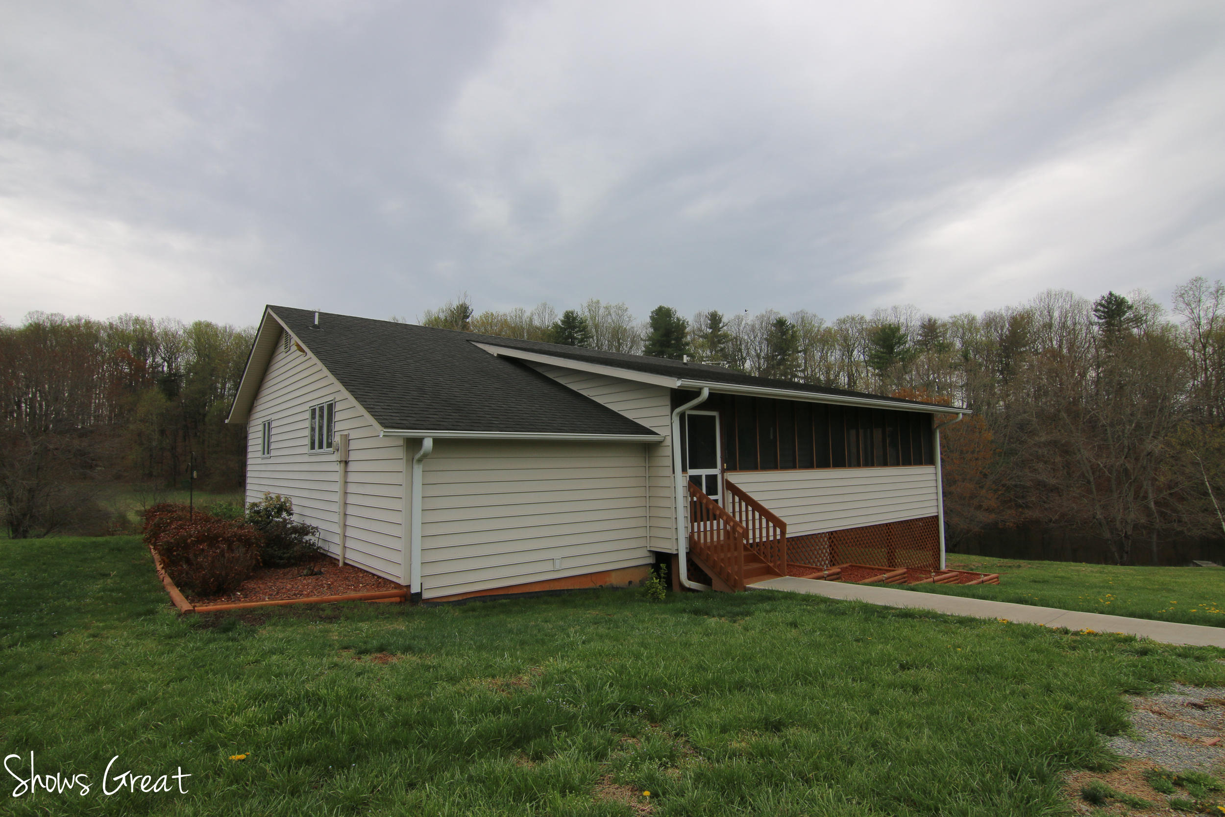 3315 Retreat Road Boones Mill, VA 24065 - Photo 23 of 57 a view of a backyard with a garden and entertaining space