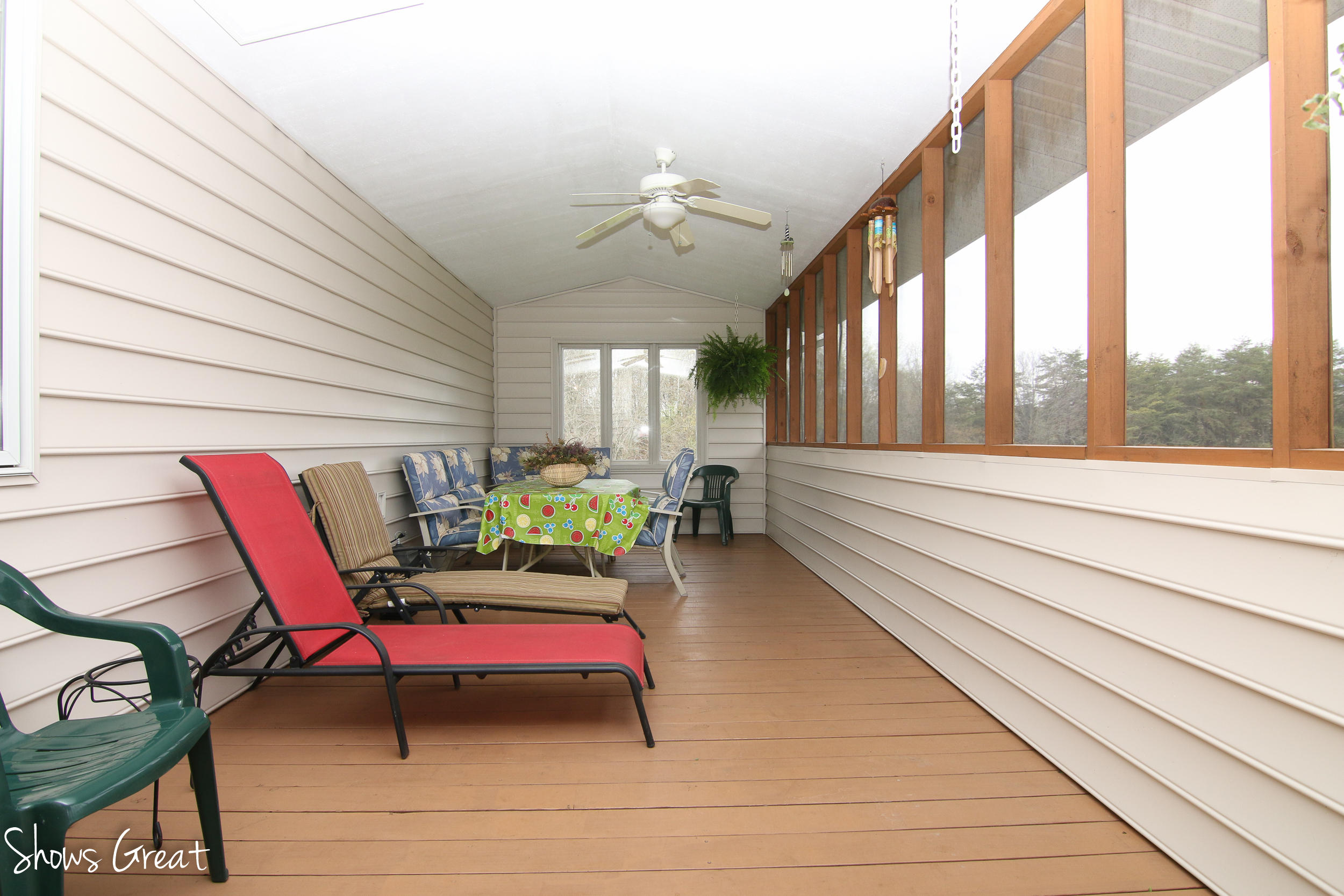 3315 Retreat Road Boones Mill, VA 24065 - Photo 25 of 57 a balcony with furniture and a large window