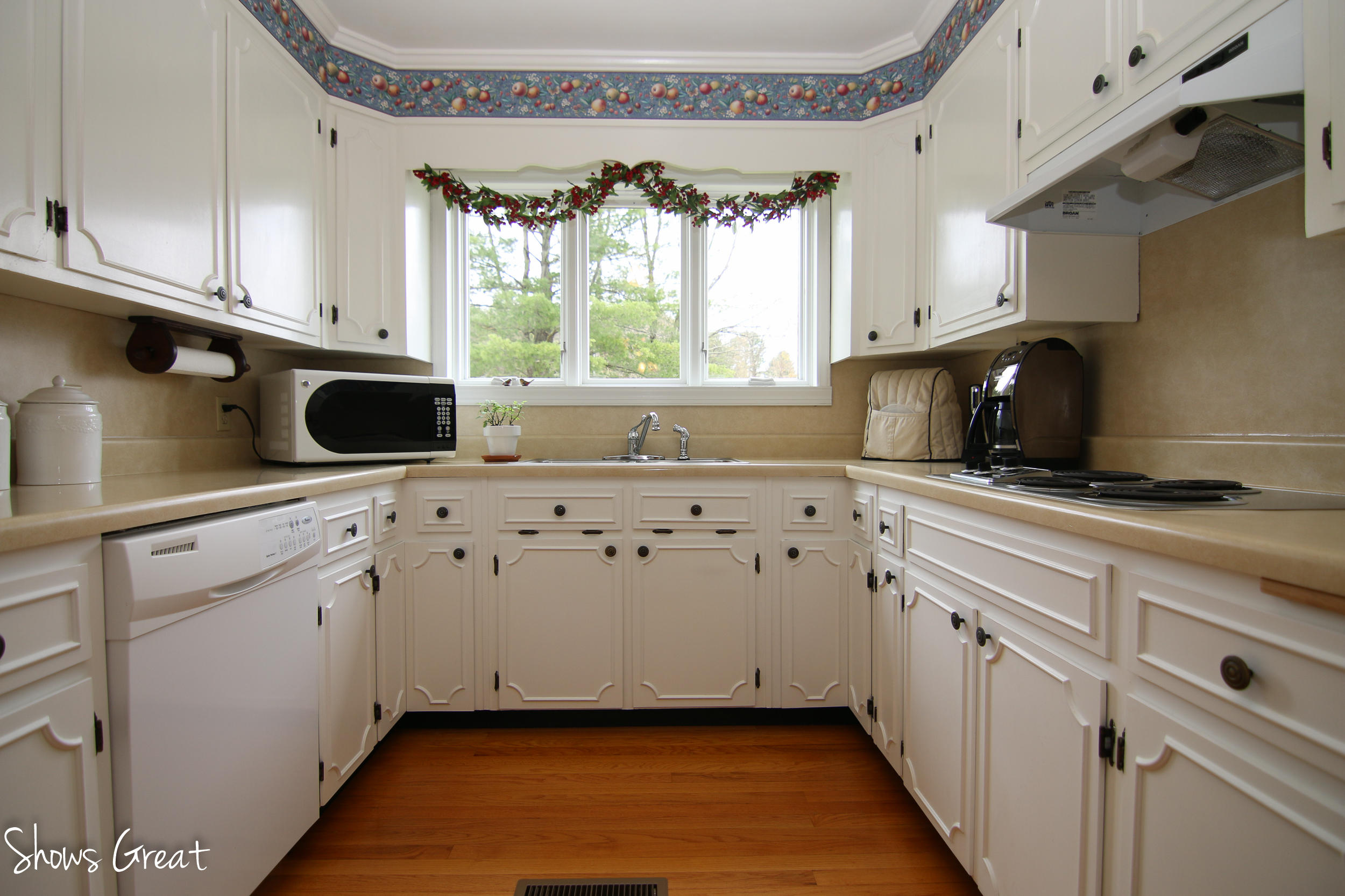 3315 Retreat Road Boones Mill, VA 24065 - Photo 26 of 57 a kitchen with stainless steel appliances white cabinets large window and a sink