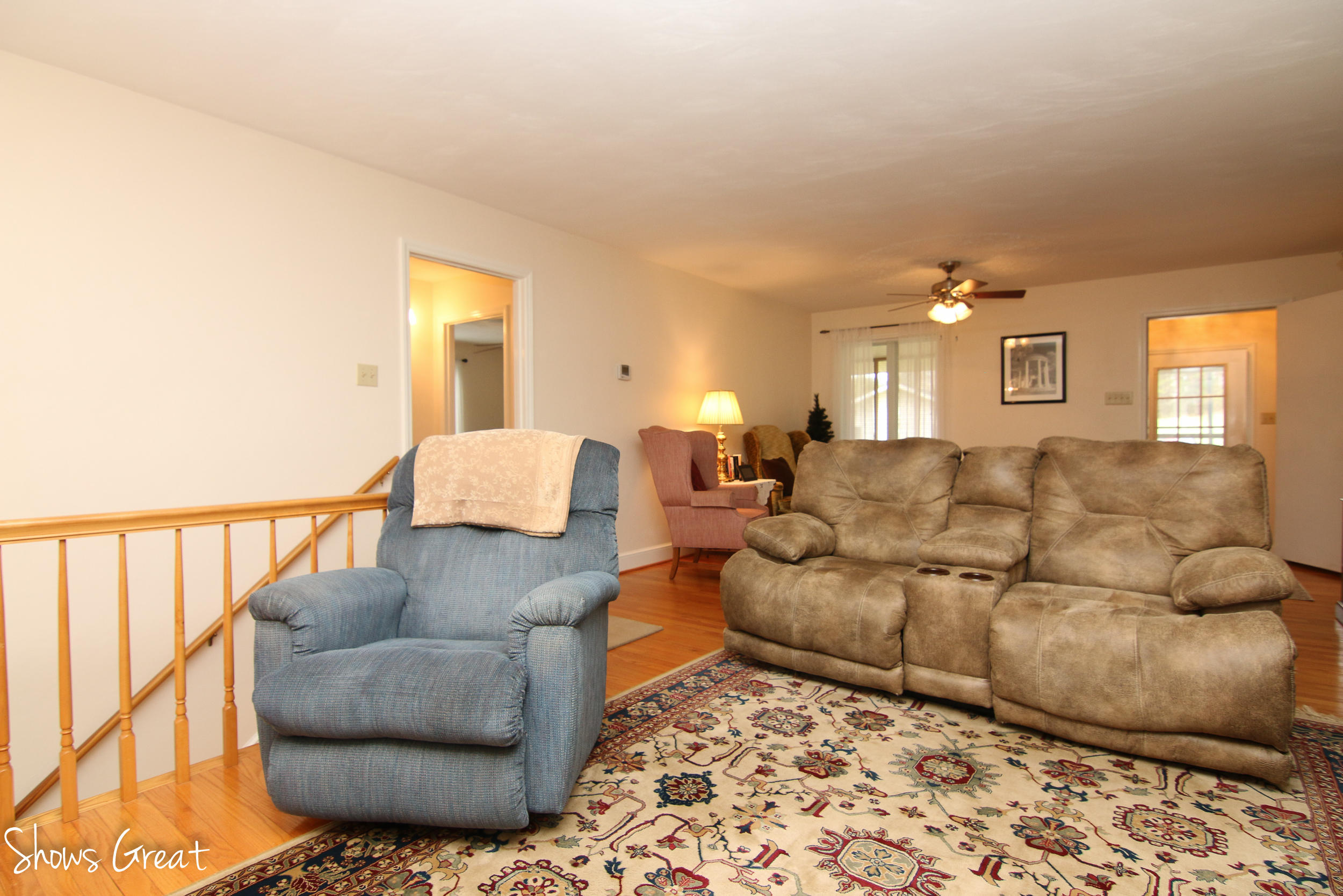 3315 Retreat Road Boones Mill, VA 24065 - Photo 33 of 57 a living room with a couch and painting on the wall
