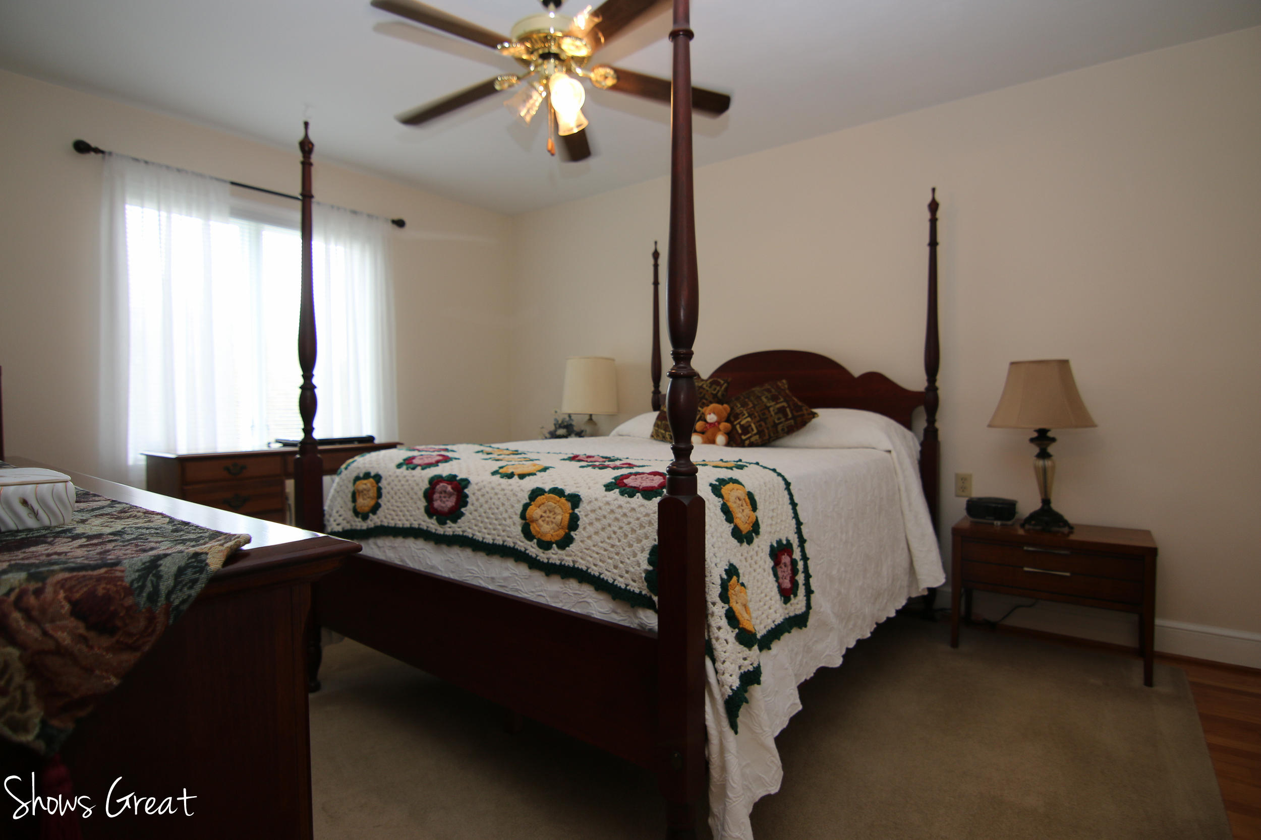 3315 Retreat Road Boones Mill, VA 24065 - Photo 36 of 57 a bedroom with bed and a chandelier