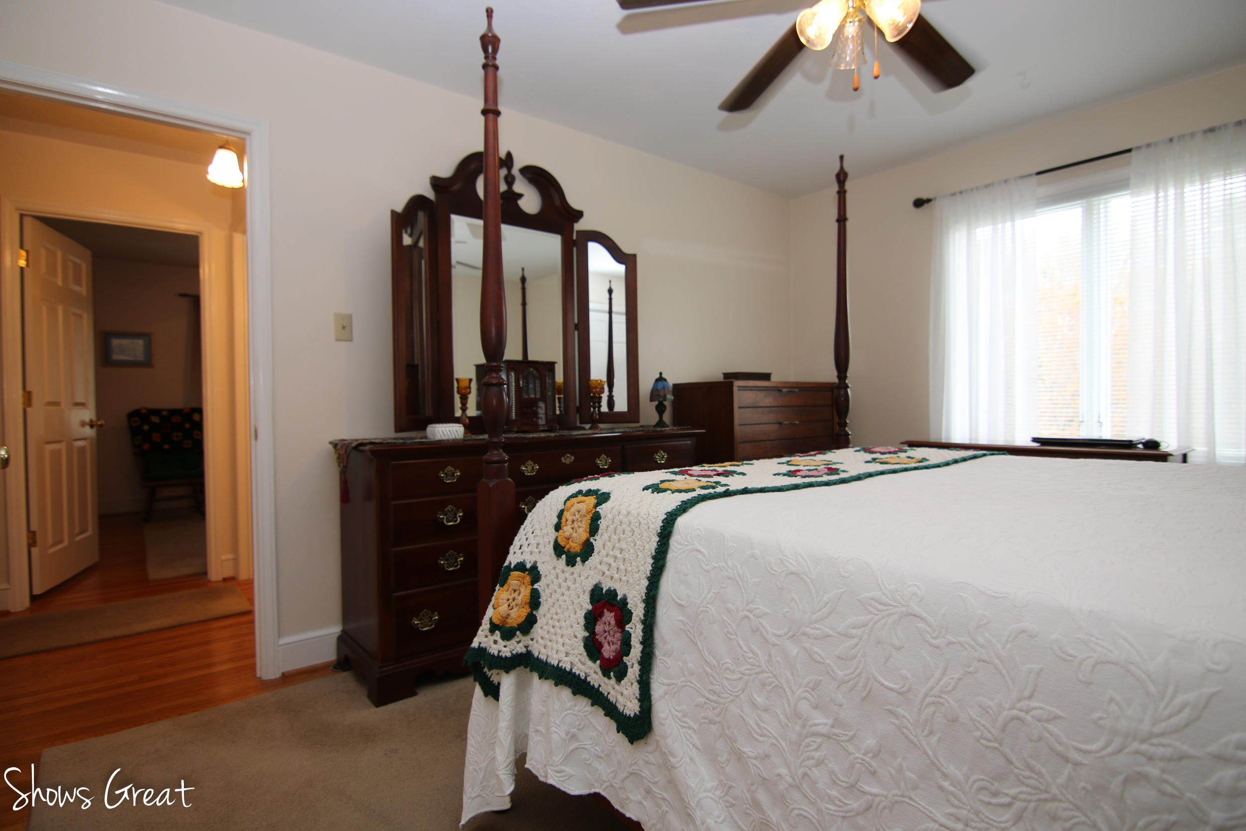 3315 Retreat Road Boones Mill, VA 24065 - Photo 37 of 57 a bedroom with a bed and a chandelier