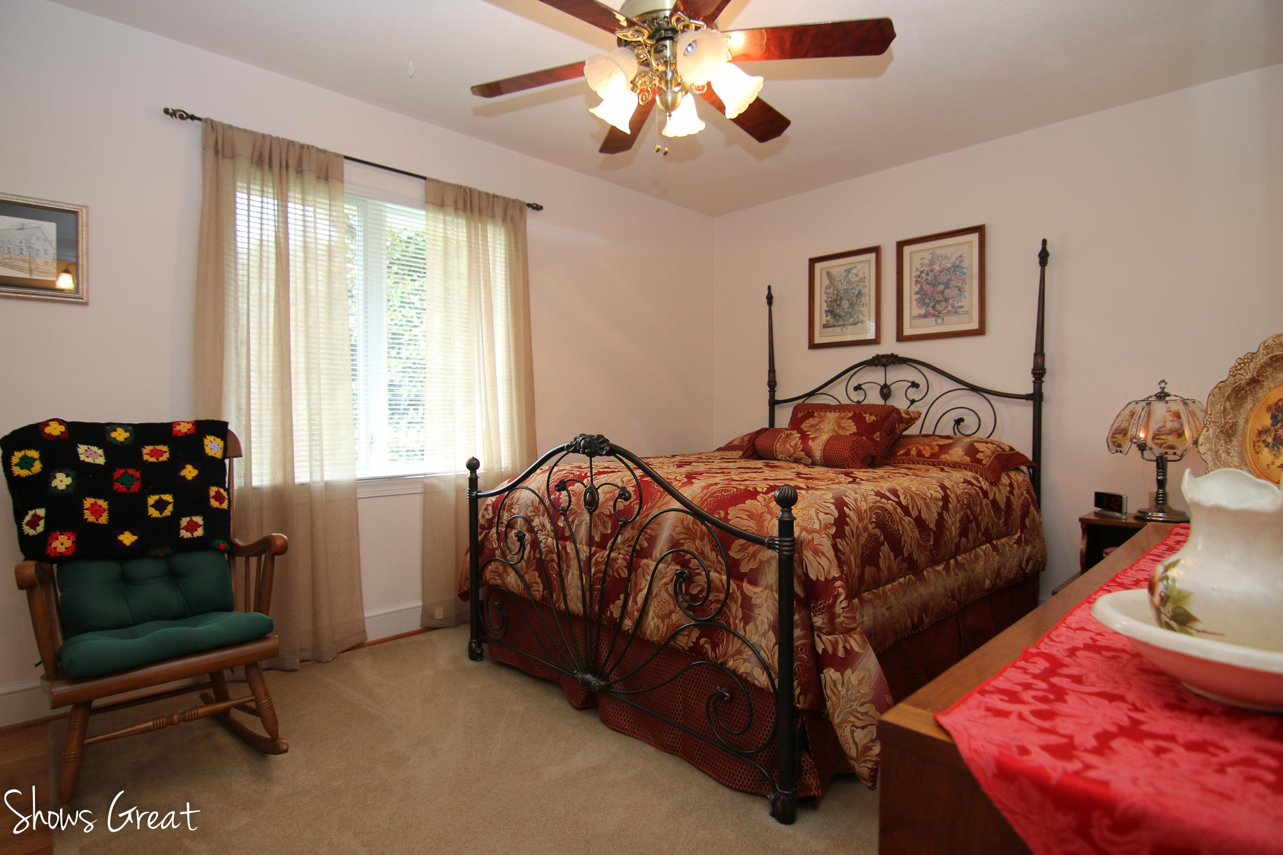 3315 Retreat Road Boones Mill, VA 24065 - Photo 39 of 57 a bedroom with a bed and a chandelier