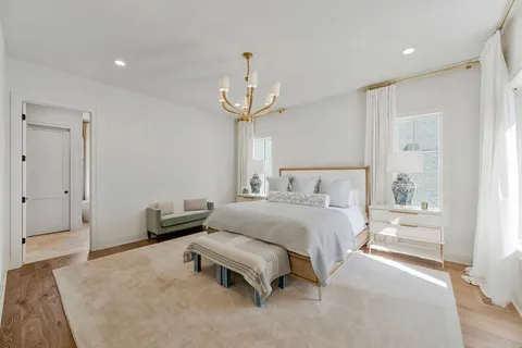 a white tub sitting next to a window