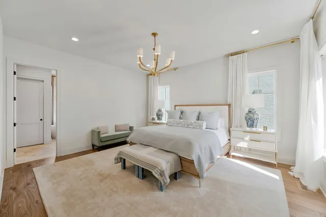 a white tub sitting next to a window