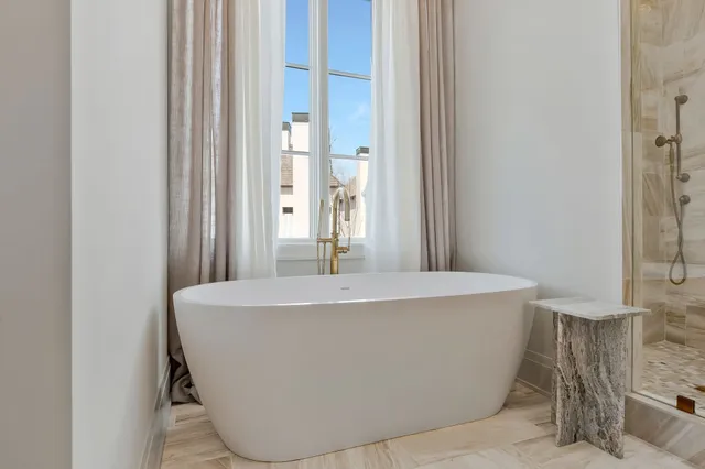 a spacious bedroom with a bed and a couch