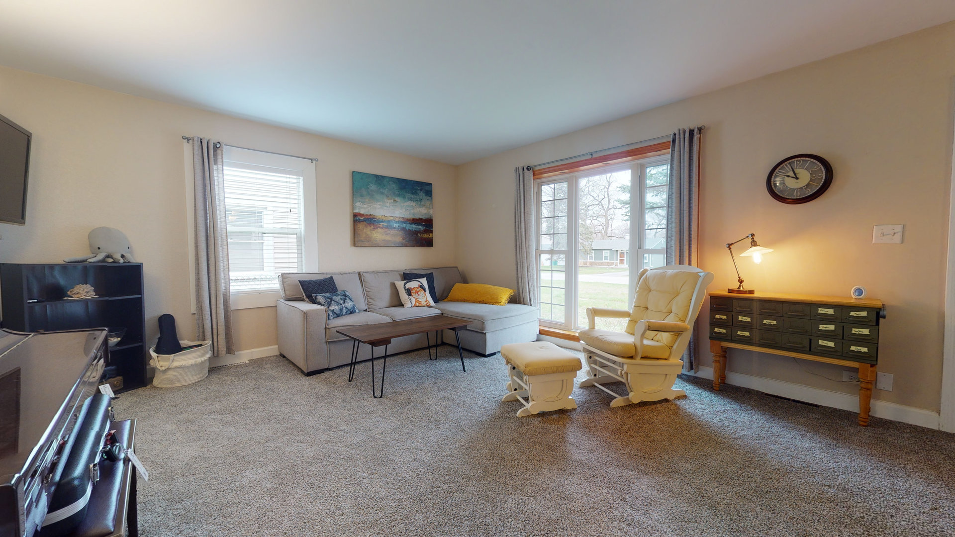 209 Raupp Boulevard Buffalo Grove, IL 60089 - Photo 3 of 13 a living room with furniture and a large window