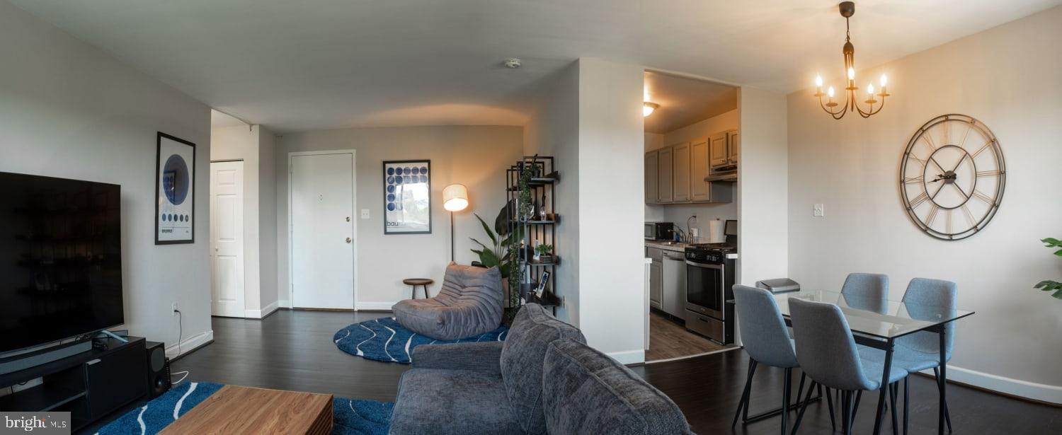 1300 South Arlington Ridge Road, Unit 705 Arlington, VA 22202 - Photo 4 of 25 a view of a dining room with furniture and chandelier