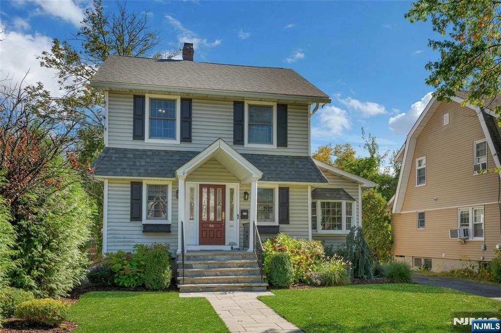 66 Smull Avenue Caldwell, NJ 07006 - Photo 2 of 32 a front view of a house with a yard