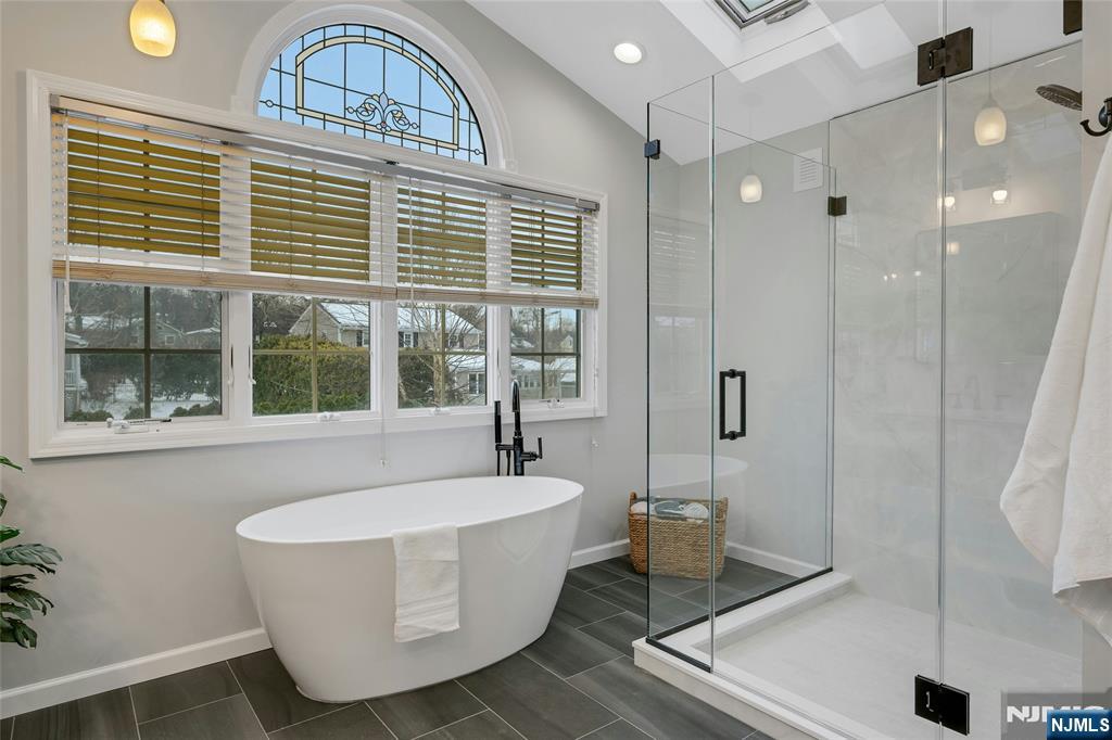 66 Smull Avenue Caldwell, NJ 07006 - Photo 22 of 32 a bathroom with a bathtub and sink