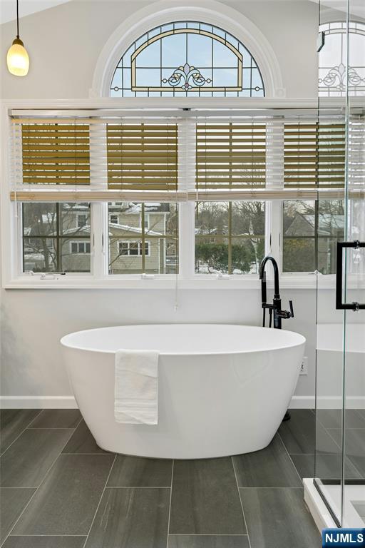 66 Smull Avenue Caldwell, NJ 07006 - Photo 25 of 32 a bathroom with a bathtub and window