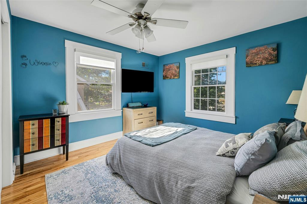 66 Smull Avenue Caldwell, NJ 07006 - Photo 27 of 32 a bedroom with a bed and wooden floor