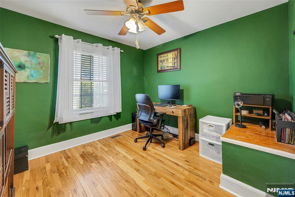 66 Smull Avenue Caldwell, NJ 07006 - Photo 28 of 32 a work room with furniture and a window